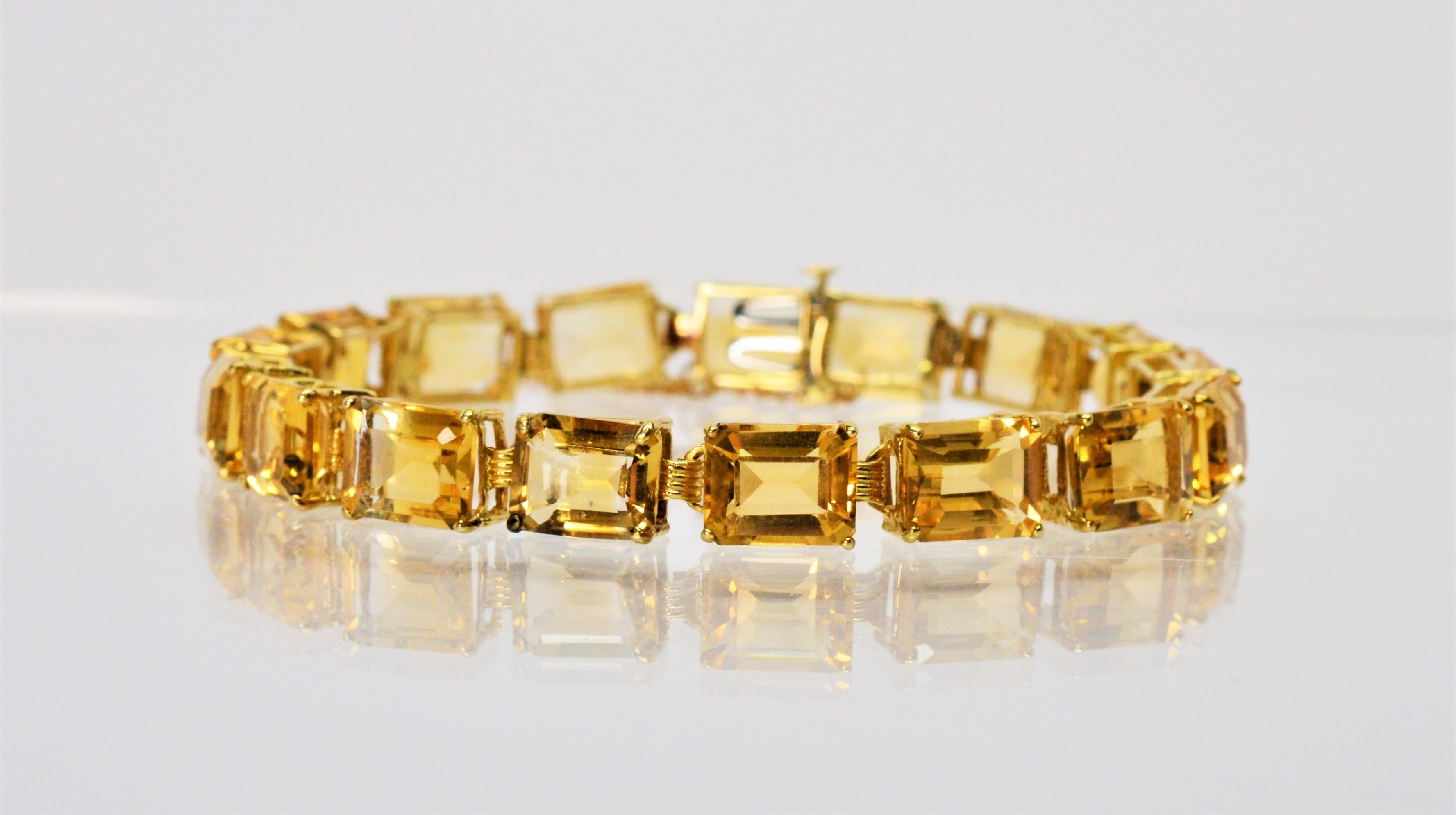 Representing the warmth of the sun and vitality of life, seventeen natural 8 x 10 mm emerald-cut natural citrine semi-precious gemstones for an approximately 49.3 carats total weight light up this brilliant 8.25 inch link bracelet set in fourteen