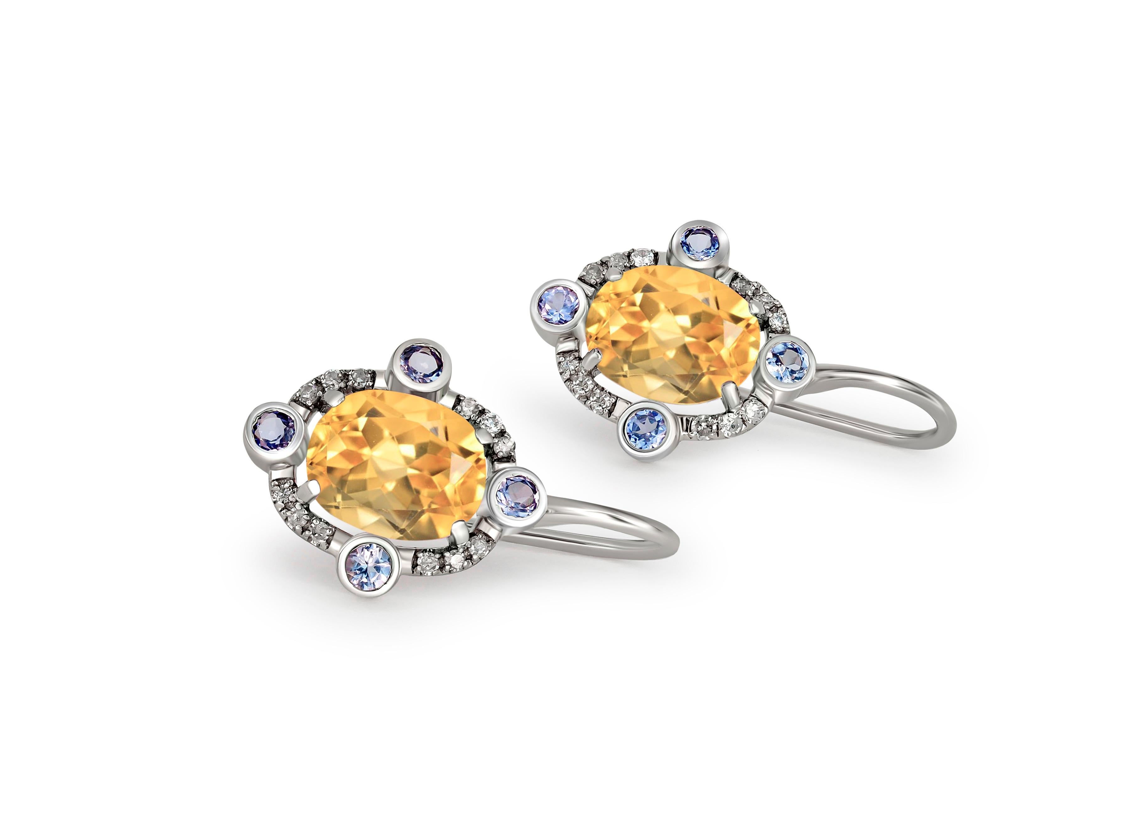 Citrine 14k gold drop earrings.
Oval Citrine 14k gold earrings. 14 kt gold earrings with Citrines, sapphires and diamonds. October birthstone earrings. 

Gold - 14 kt gold 
Size: 20x12 mm 
Weight: 2.50

Central stones: 
Citrine, 2 pieces, oval cut,