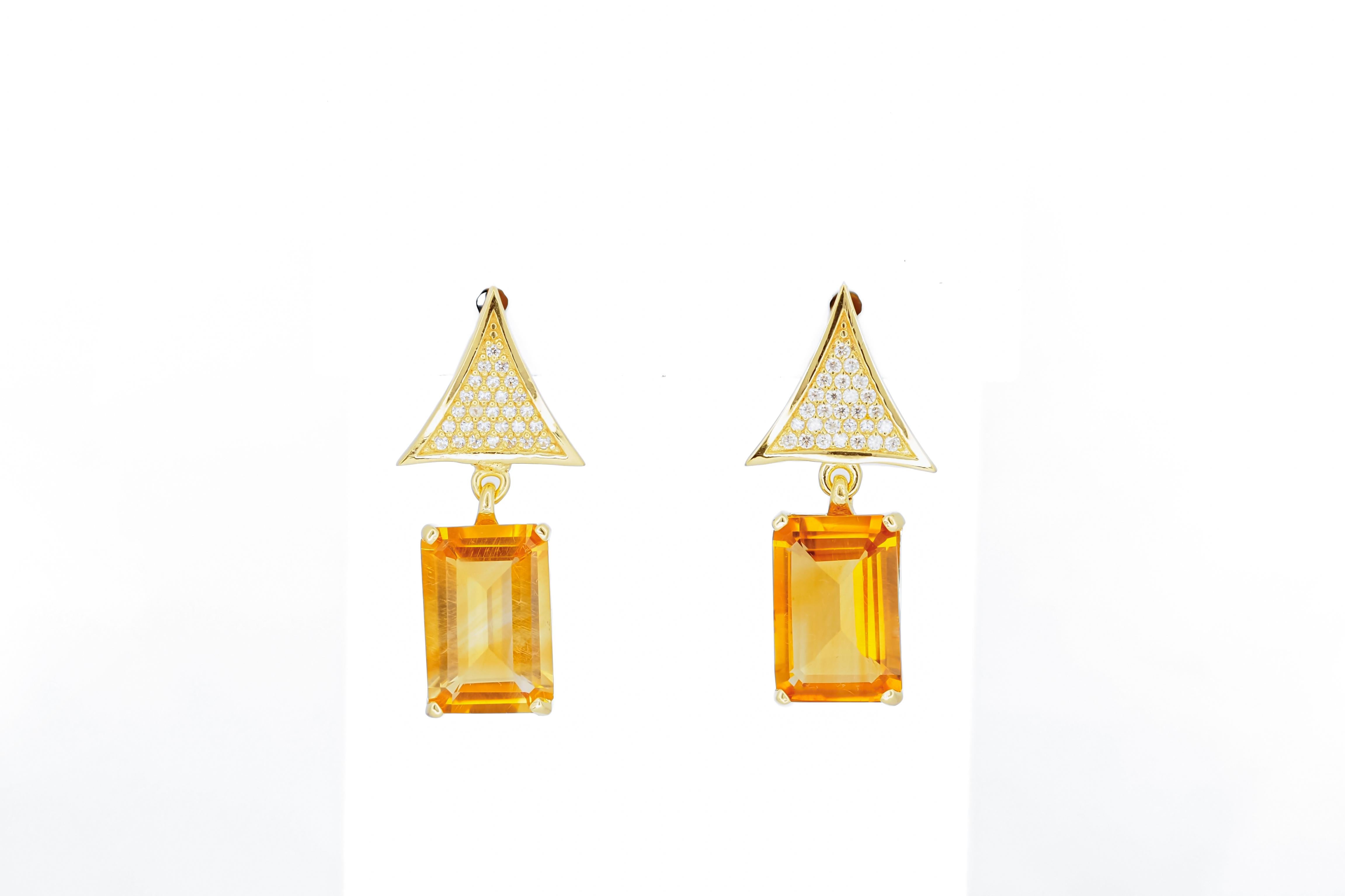 Citrine 14k gold earrings studs. 
Citrine statement earrings. Delicate citrine earrings studs. Diamond triangle earrings.

Metal: 14k gold
weight: 4 gr
Earrings size: 23x11 mm

Set with citrines, color - yellow 
Emerald cut, apx 6 ct. in