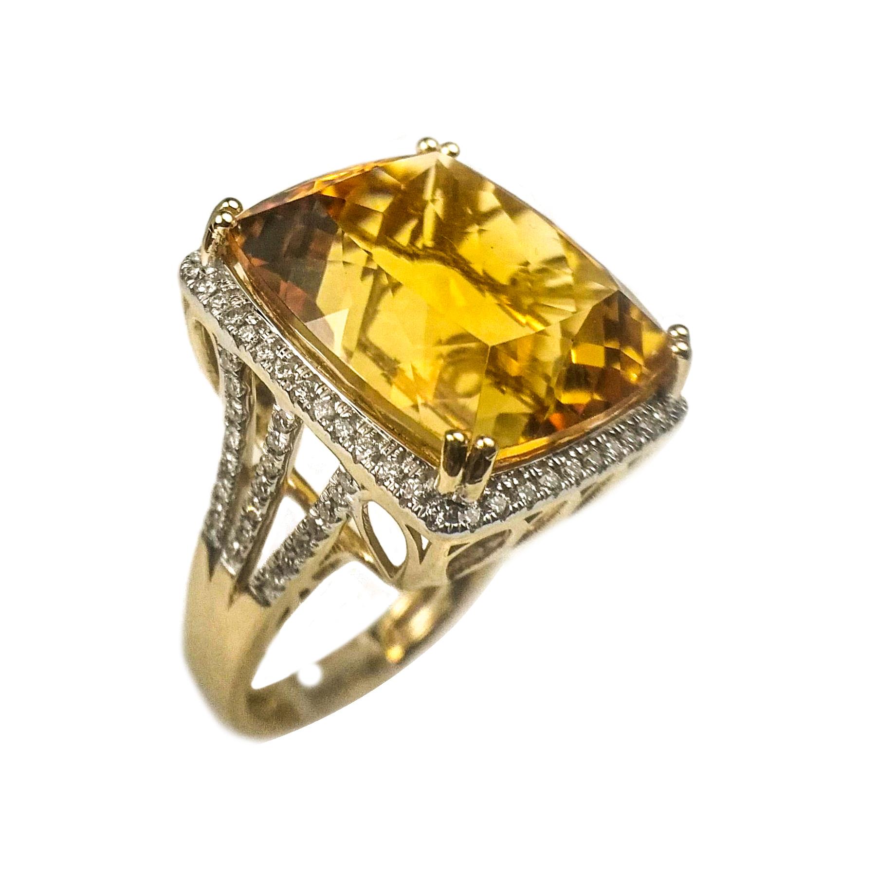Glamorous citrine diamond ring. Handcrafted golden honey yellow, high luster, cushion faceted 21.61 carats citrine set in high profile, encased in basket mounting with eight bead prongs, accented with round brilliant cut diamonds on frame and 3