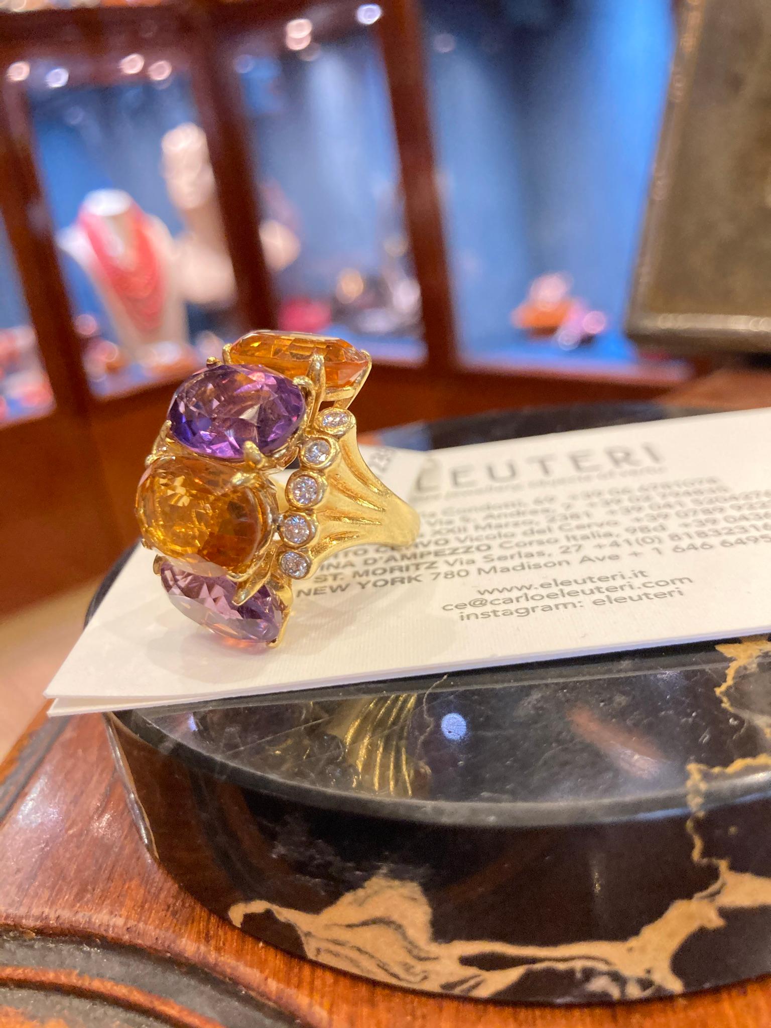 A fun vintage cocktail ring featuring amethysts, citrines, and 0.80 carats of diamonds mounted in yellow gold. Circa 1970.