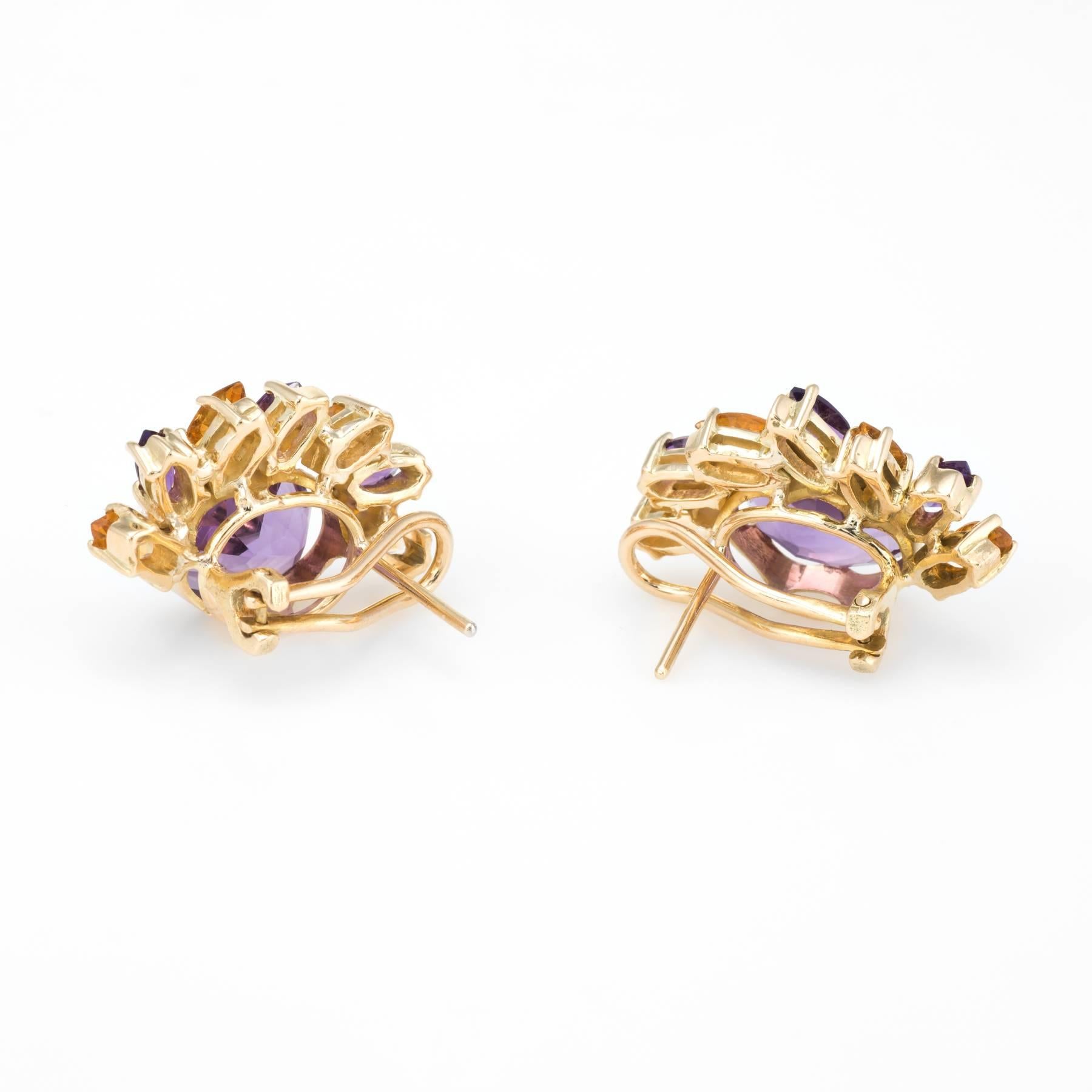 Stylish pair of amethyst & citrine half moon earrings, crafted in 14k yellow gold. 

Oval faceted amethyst measures 12mm x 10mm (estimated at 4.50 carats each - 9 carats total estimated weight), accented with 6 x 5mm x 2.75mm marquise cut amethyst