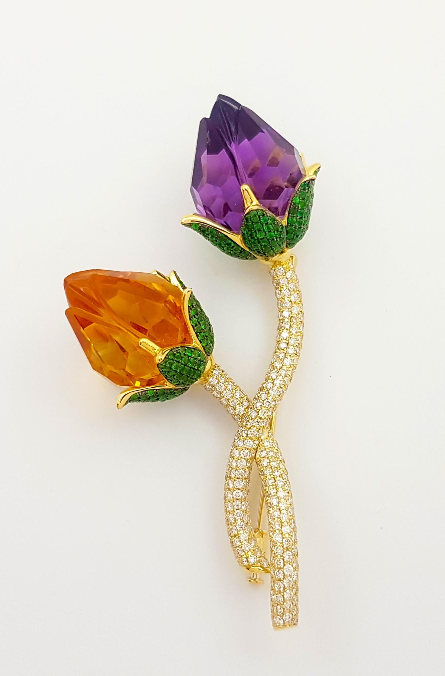 Citrine 51.67 carats, Amethyst 54.78 carats, Tsavorite 4.46 carats and Brown Diamond 3.97 carats Brooch set in 18K Gold Settings

Width: 5.5 cm 
Length: 9.0 cm
Total Weight: 61.03 grams

