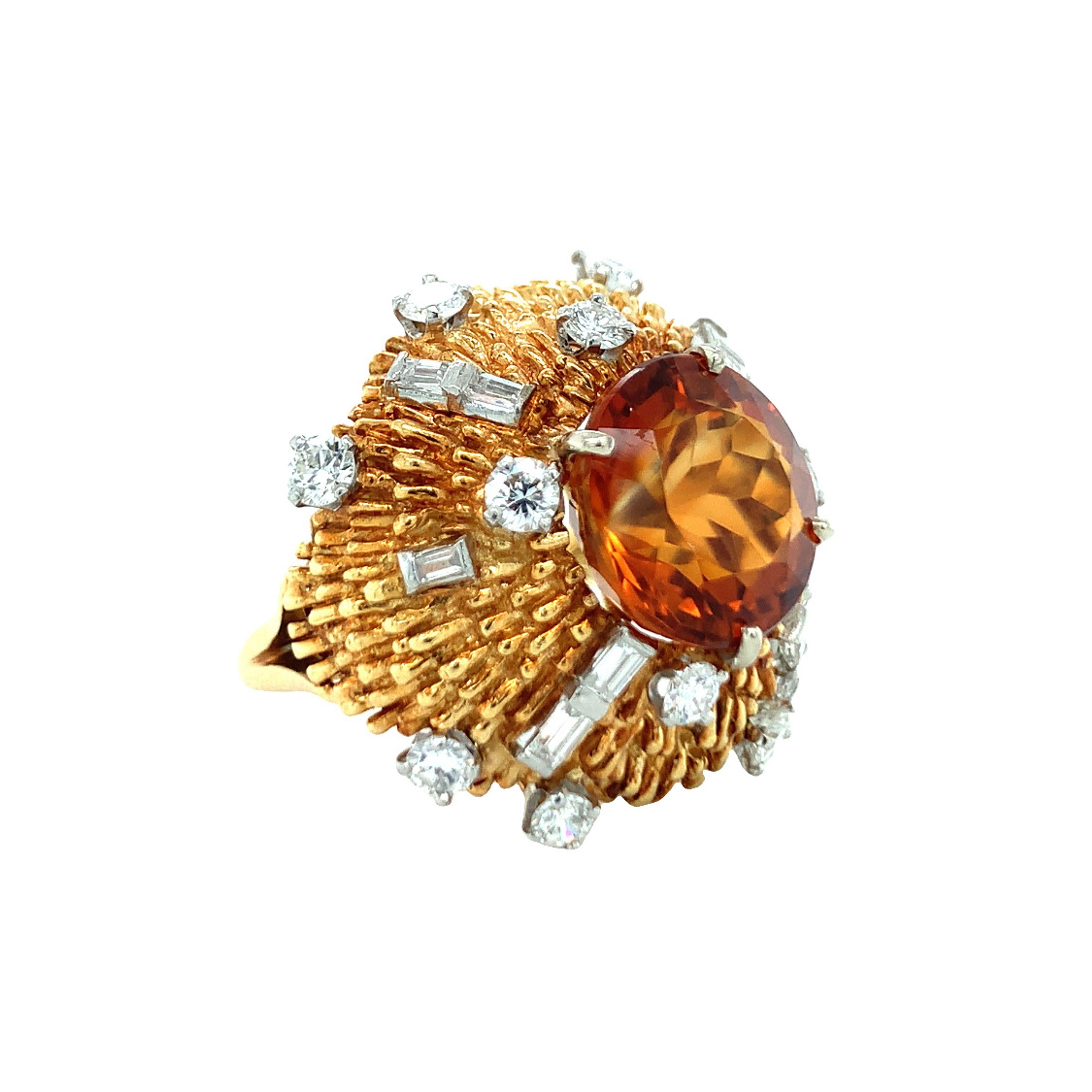 One citrine and diamond 18K yellow gold and platinum ring centering one deep orangey amber color citrine weighing 7 ct. The ring is enhanced by platinum set, round brilliant and baguette cut diamonds weighing a total of 2.25 ct. with G color and