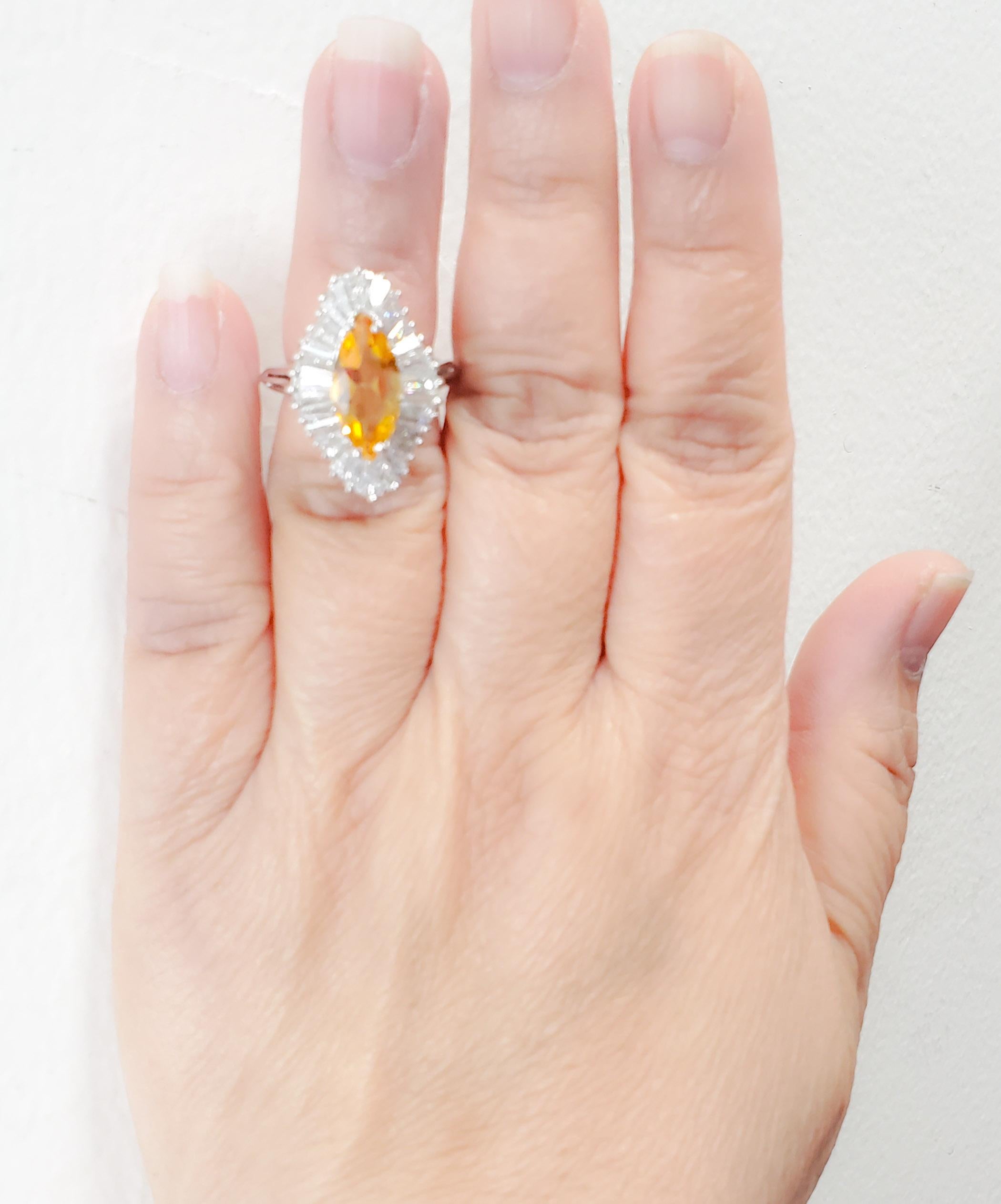 Beautiful 2.09 ct. citrine marquise with good quality white diamond baguettes.  Diamond weight is approximately 1.00 ct.  Handmade in 14k white gold.  Ring size 5.5.