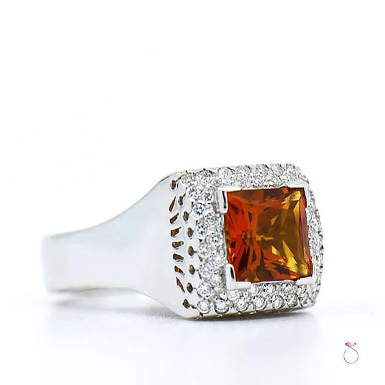 Cetrine & diamond ring by Assor Gioielli. Beautiful square shape orange citrine set in a well crafted 18k white gold ring & surrounded by a diamond double halo of round brilliant cut diamonds. The approximately 2.50 carat citrine measures