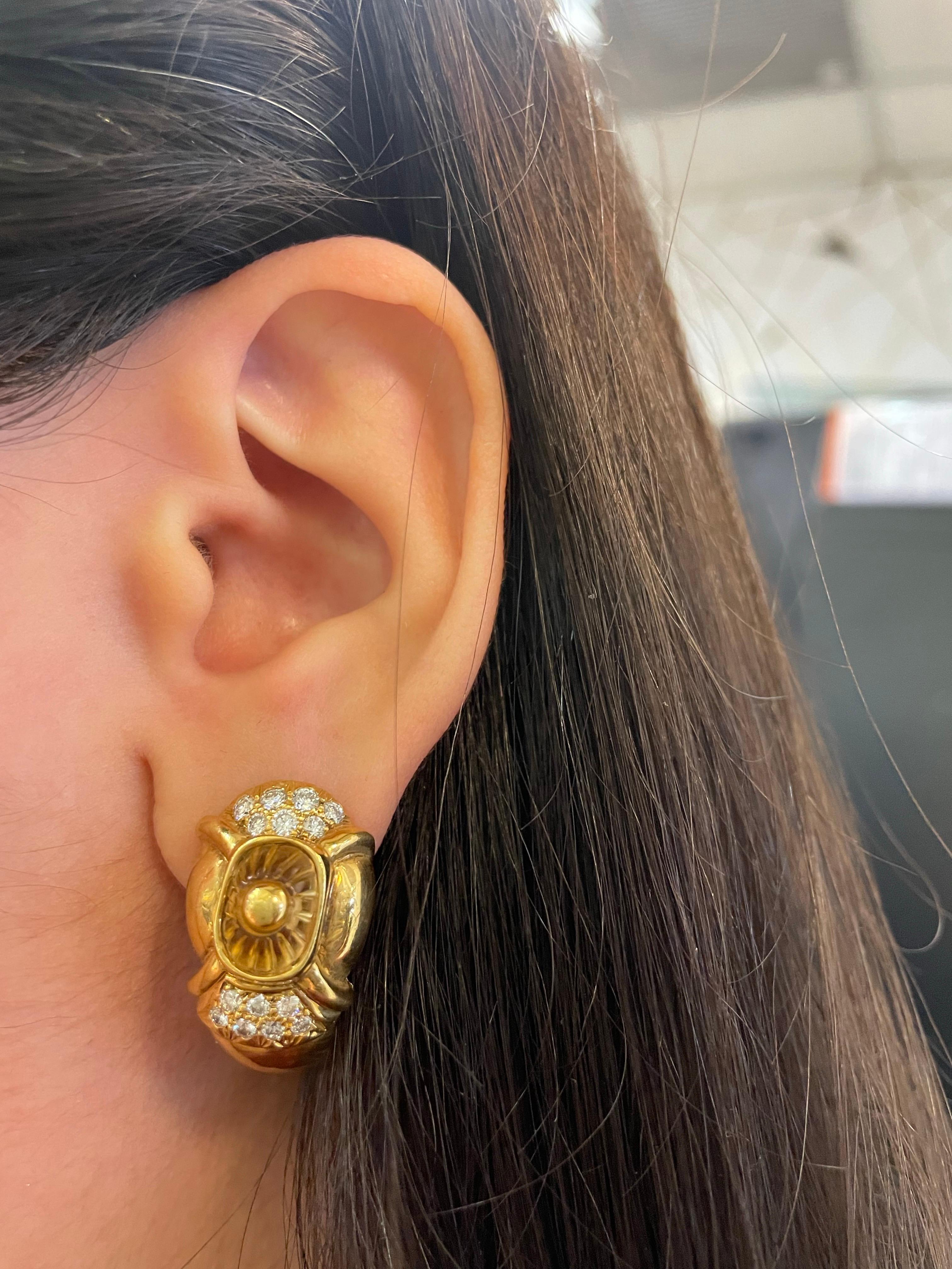 Citrine and Diamond Earrings 

Yellow gold earrings adorned with round cut diamonds and a carved citrine in the middle. 

Approximate Length: 1