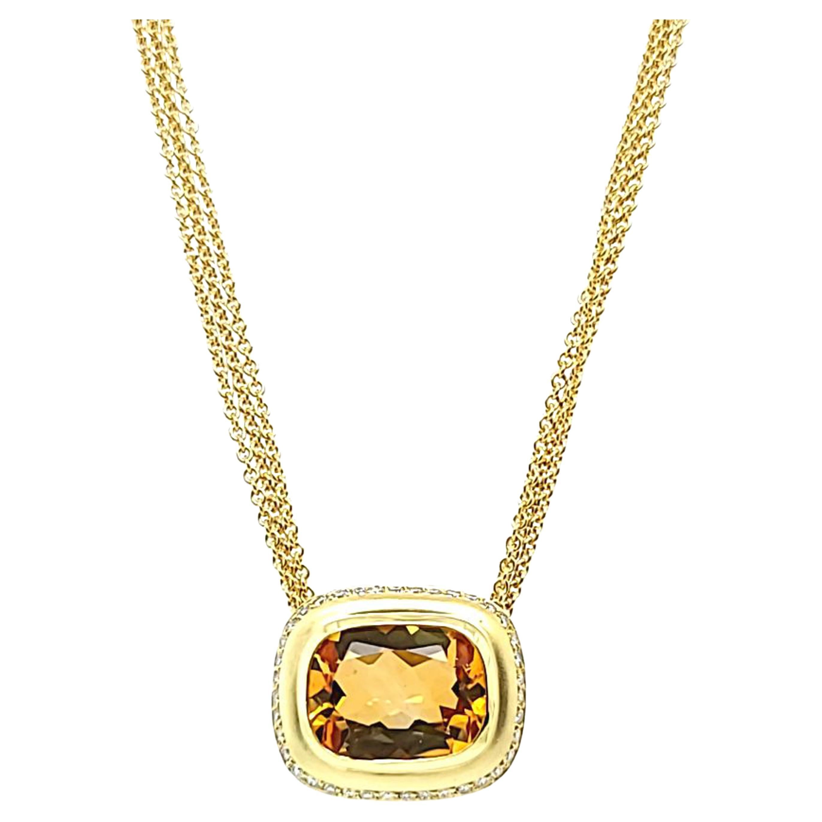 18 Karat Brushed Yellow Gold Slide Pendant Necklace Featuring A Bezel-set Cushion Cut Citrine Weighing Approximately 10 Carats Surrounded by 39 Round Brilliant Cut Diamonds of SI Clarity and H Color Totaling 0.39 Carats. 16 Inch Triple Chain with