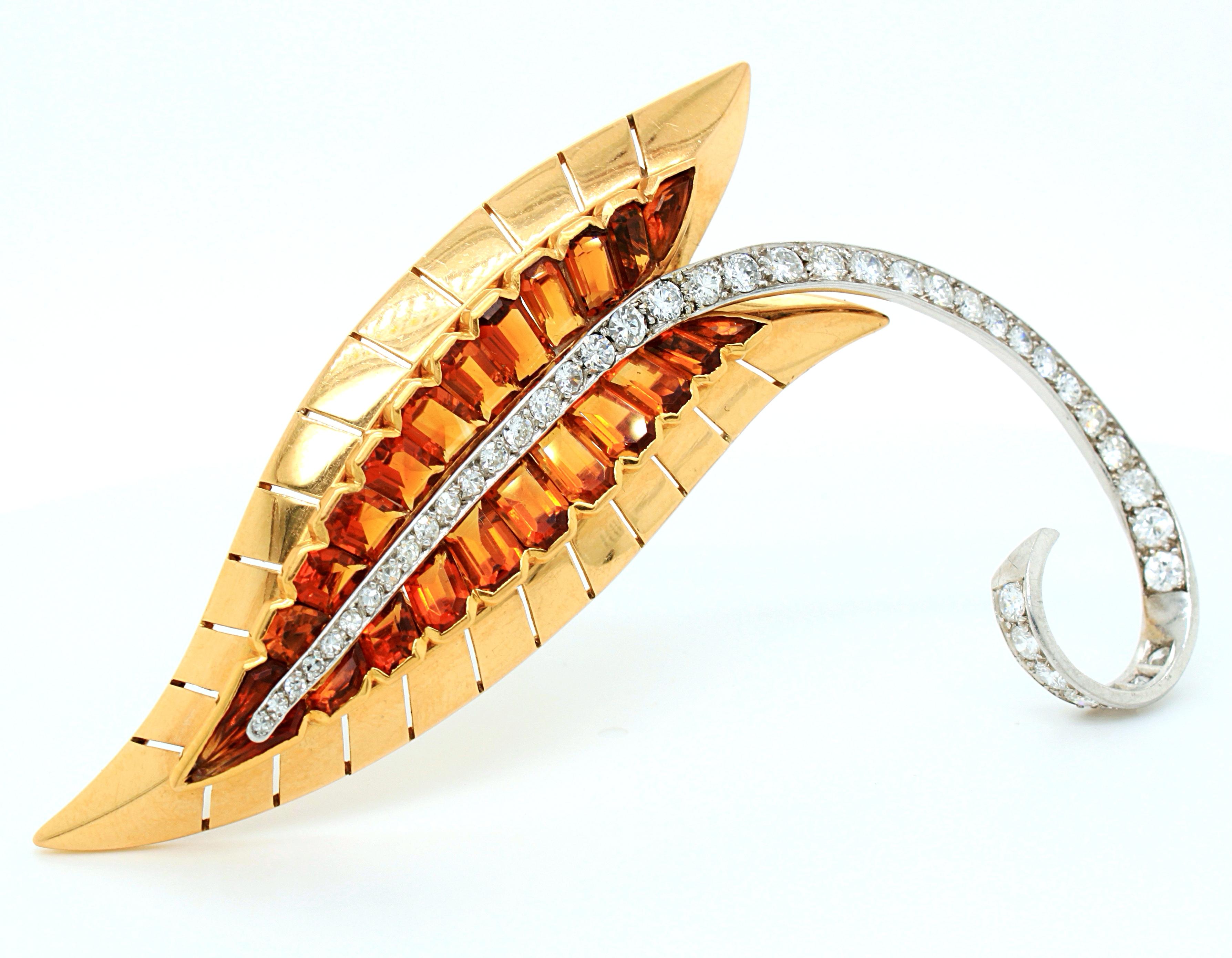 A citrine and diamond retro leaf brooch made by Sasportas, France, ca. 1960s. The Madeira citrines have a very appealing colour and are beautifully combined with round brilliant cut diamonds and yellow gold to produce a very strong geometric, yet