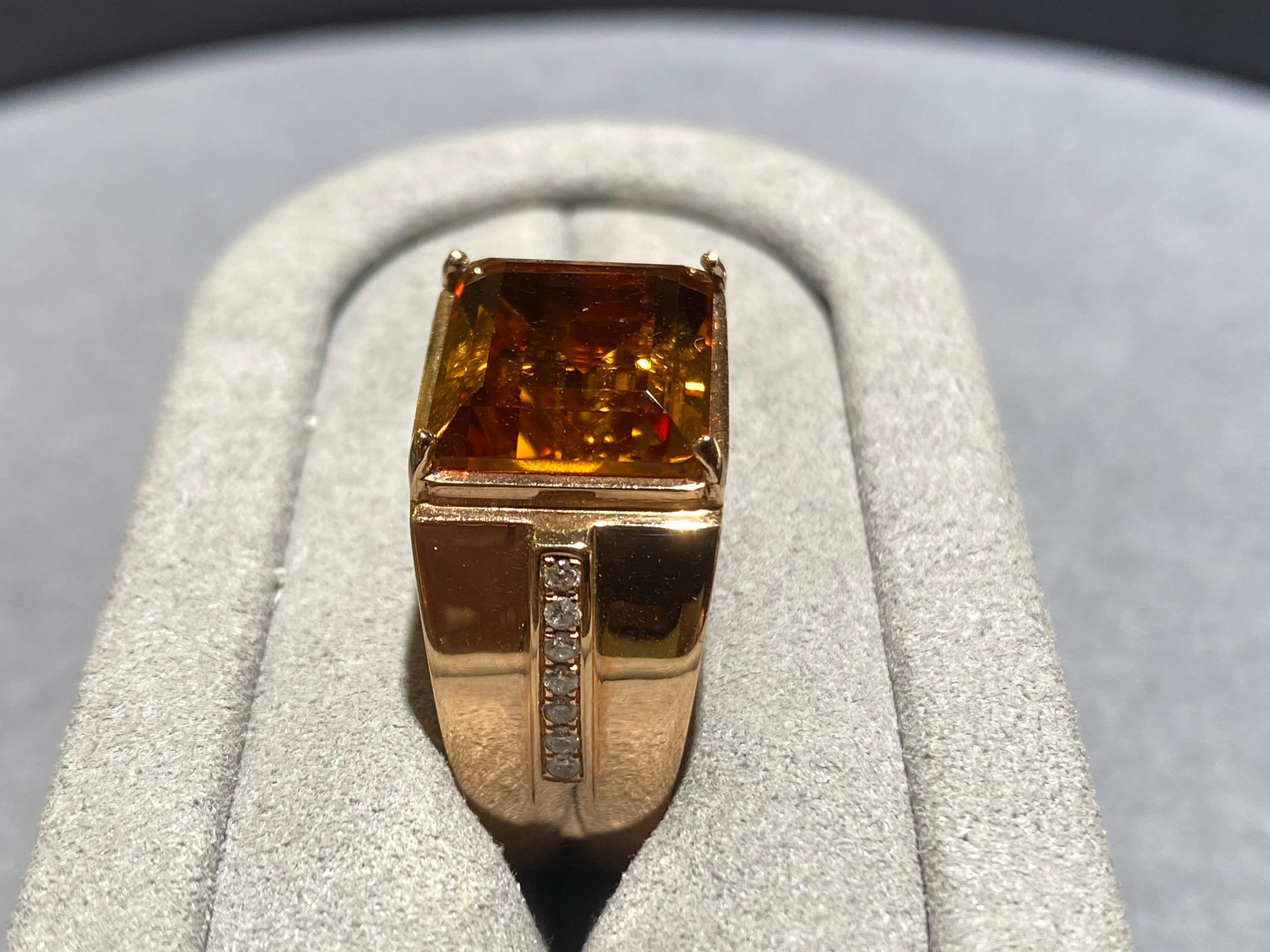 A 7.5 ct Citrine and diamond ring i 18k rose gold. It is a simple design with the main citrine in the middle and 2 lines of diamond pave at 2 side of the ring. 

US Ring size 8.5
