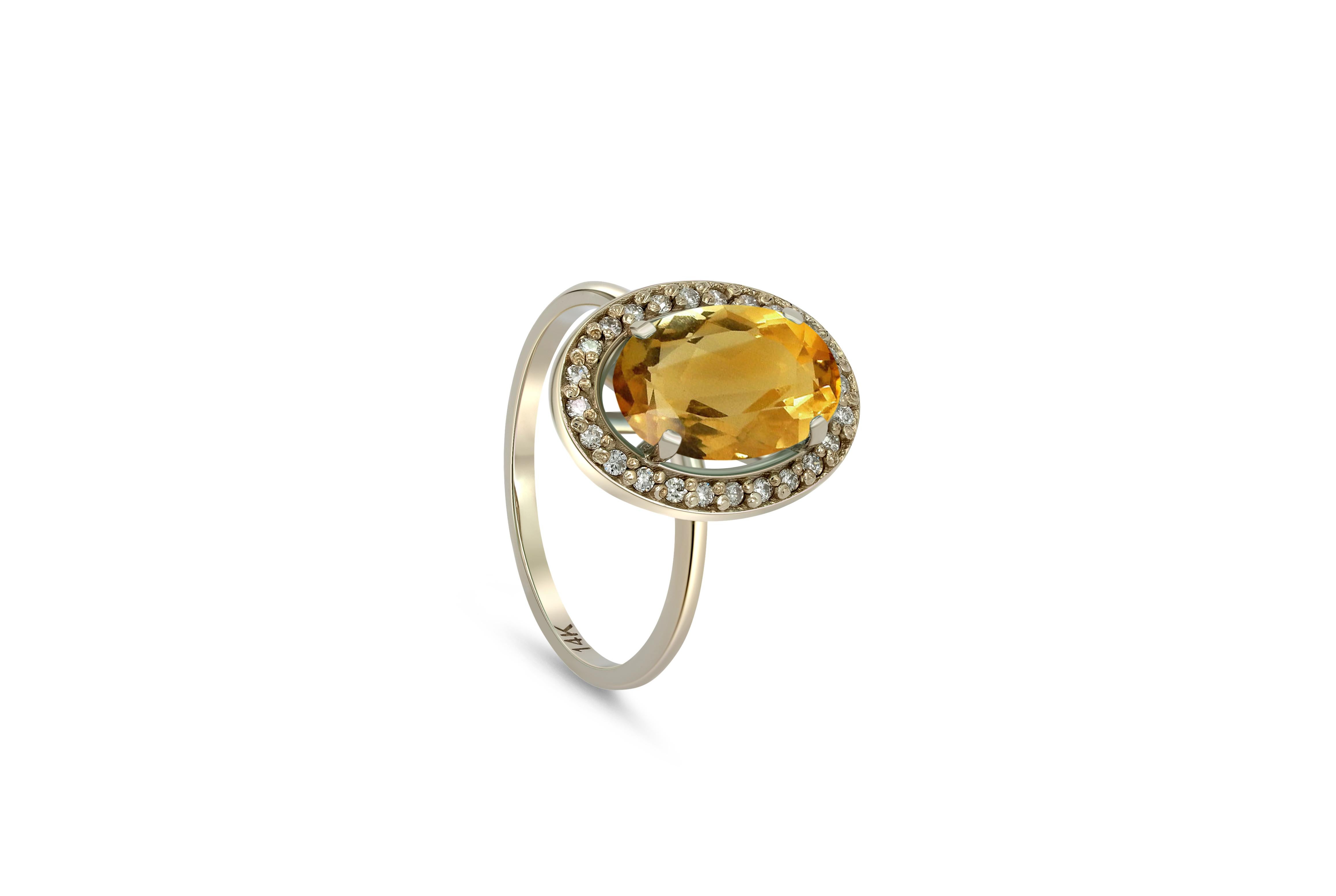 Citrine and diamonds 14k gold ring. 
Oval Citrine gold ring. Citrine diamond halo ring. Yellow gemstone ring.

Metal: 14k gold
Weight: 3 gr depends from size

Gemstones:
Citrine - 1 piece
Cut - oval
Color - yellow
Weight - 3-3.2 ct

Side gemstones -