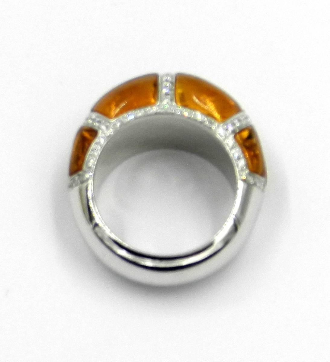 18KT White Gold RING set with eight natural CITRINES  perfectly cut to fit the ring shape and White Diamonds
Made In Italy by GARAVELLI designed by Luca Valerani
Finger size 56 ,  US 7.5
18 kt GOLD  gr : 11,40
DIAMONDS ct : 0,64
SEMIPRECIOUS NATURAL