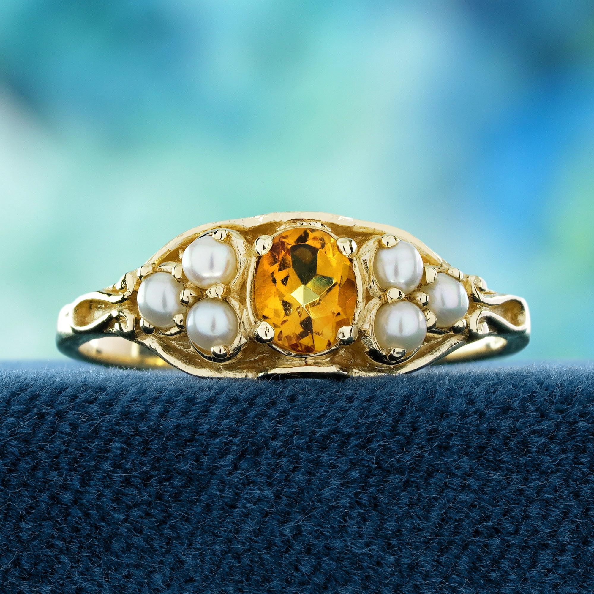 This vintage-style ring features a warm, oval-cut natural citrine at the center. Its golden glow is beautifully complemented by trio pearls on each side.Floral-inspired details bring a romantic and antique charm to the design.The soft luster of