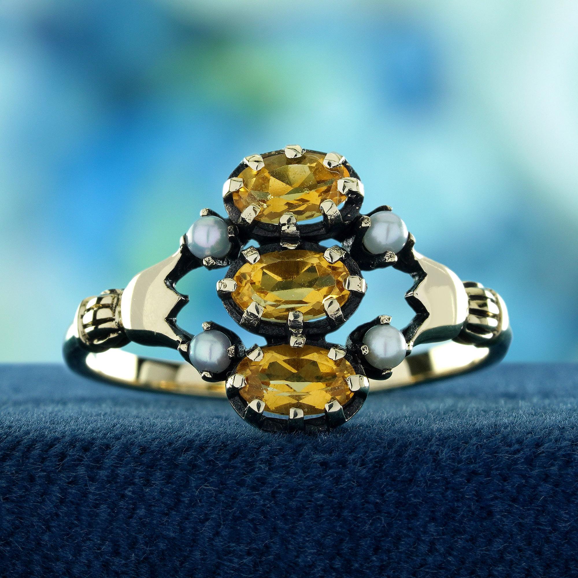 This Natural Citrine and Pearl Vintage Style Three Stones Ring in Solid 9K Yellow Gold is a captivating blend of warmth and sophistication. 
The radiant citrine stones shine with golden brilliance, symbolizing positivity and joy.The lustrous pearls
