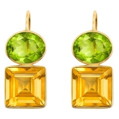 Boucles d
oreilles en argent et or avec citrine et péridot