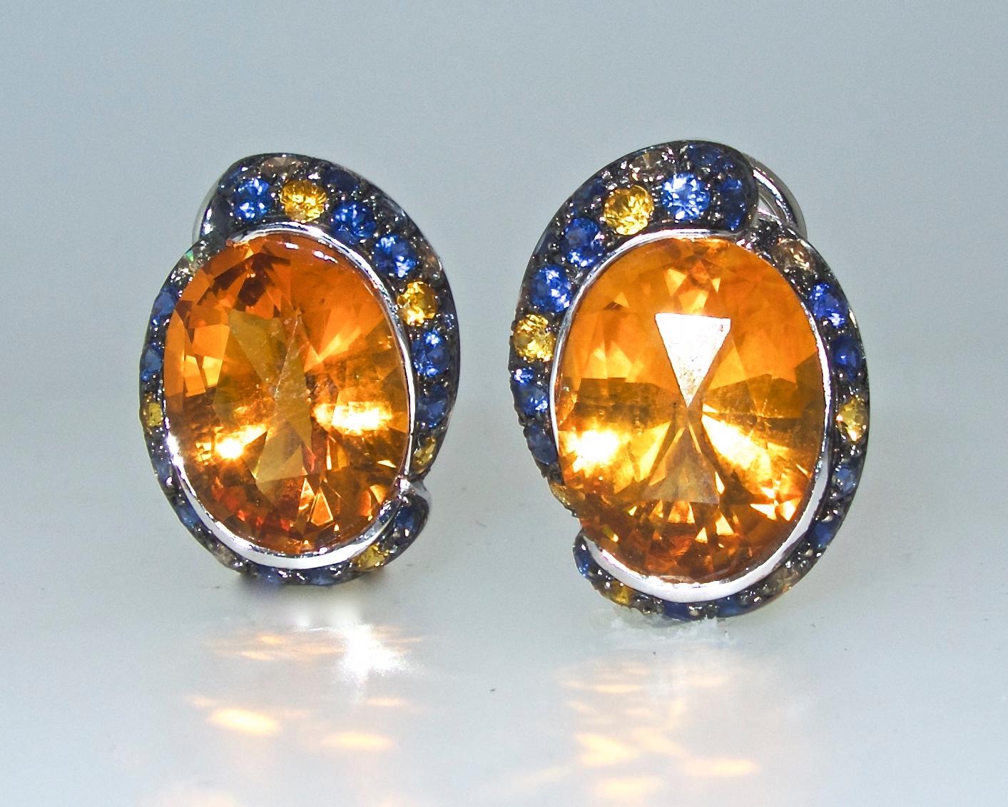 These oval natural Citrines, weighing totally approximately 20 cts.,  are bezel set in 18K white gold, they have  a vibrant bright yellow-orange referred to as Madeira Citrine - the most valuable color of Citrines.  It is important to look for this