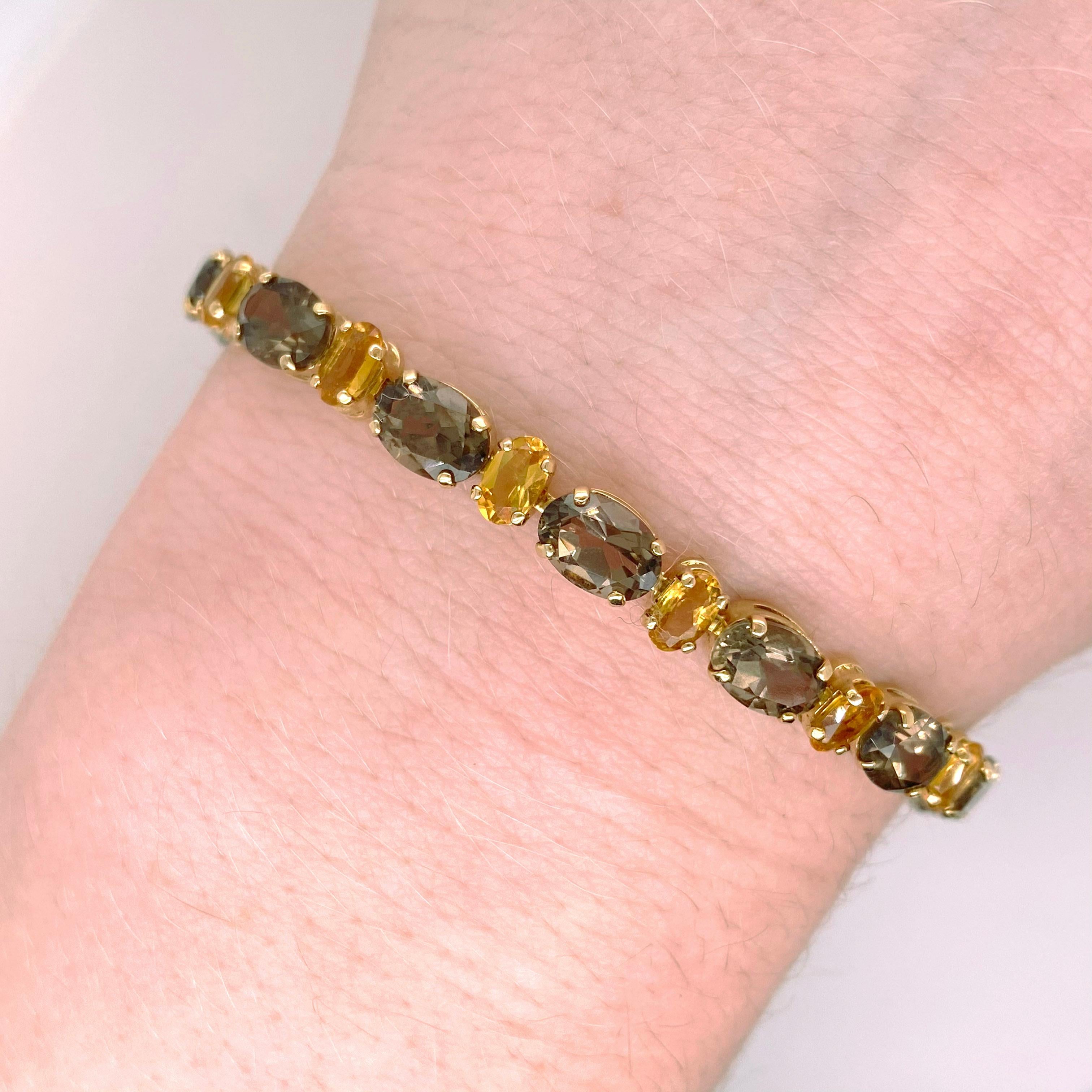 These tennis bracelet is a new twist on design.  It is created with seventeen natural smokey quartz gemstones and sixteen natural golden citrine gemstones. The bracelet will look great on any wrist and if you need it a different length-your local