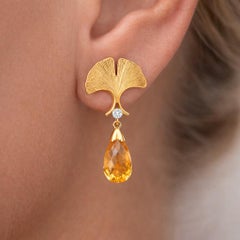 Orecchini a perno con disegno floreale Citrino briolette argento, oro