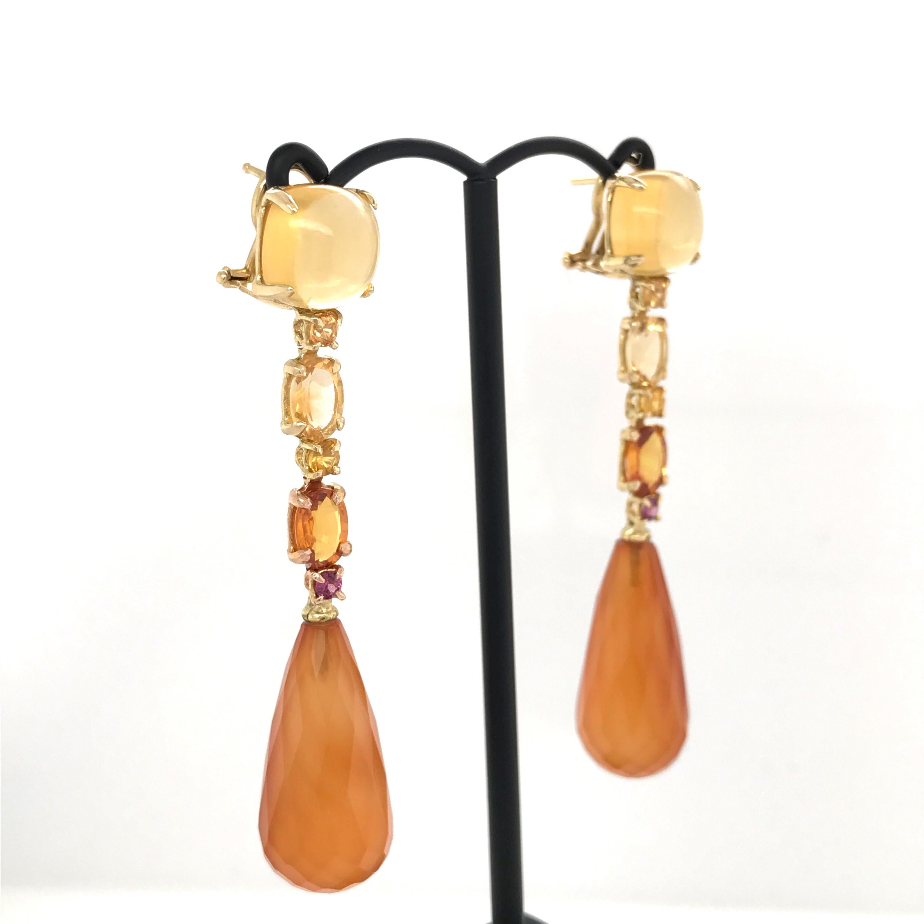 Check out these stunning chandelier earrings showcasing dazzling gemstones including citrine, carnelian and yellow sapphire. These earrings are a true work of art, harmoniously combining different colors and shapes of stones to create a luminous and