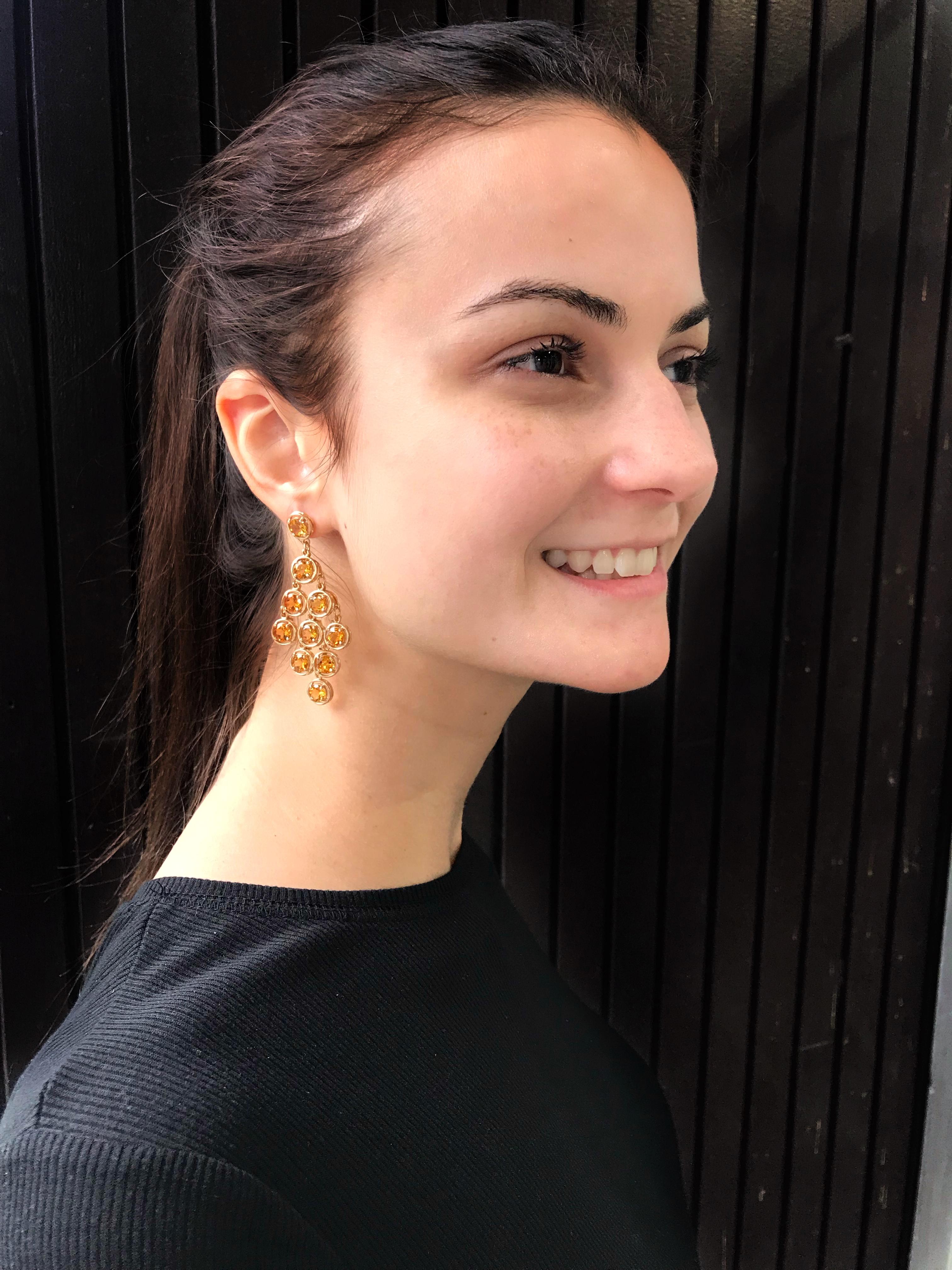 Sensational Chandelier Earrings set with twenty round faceted Citrine stones mounted in 14k yellow gold hand crafted 4-claw setting with post and butterfly closure; measuring approx. 2.5” long. A perfect complement to every wardrobe… Illuminating