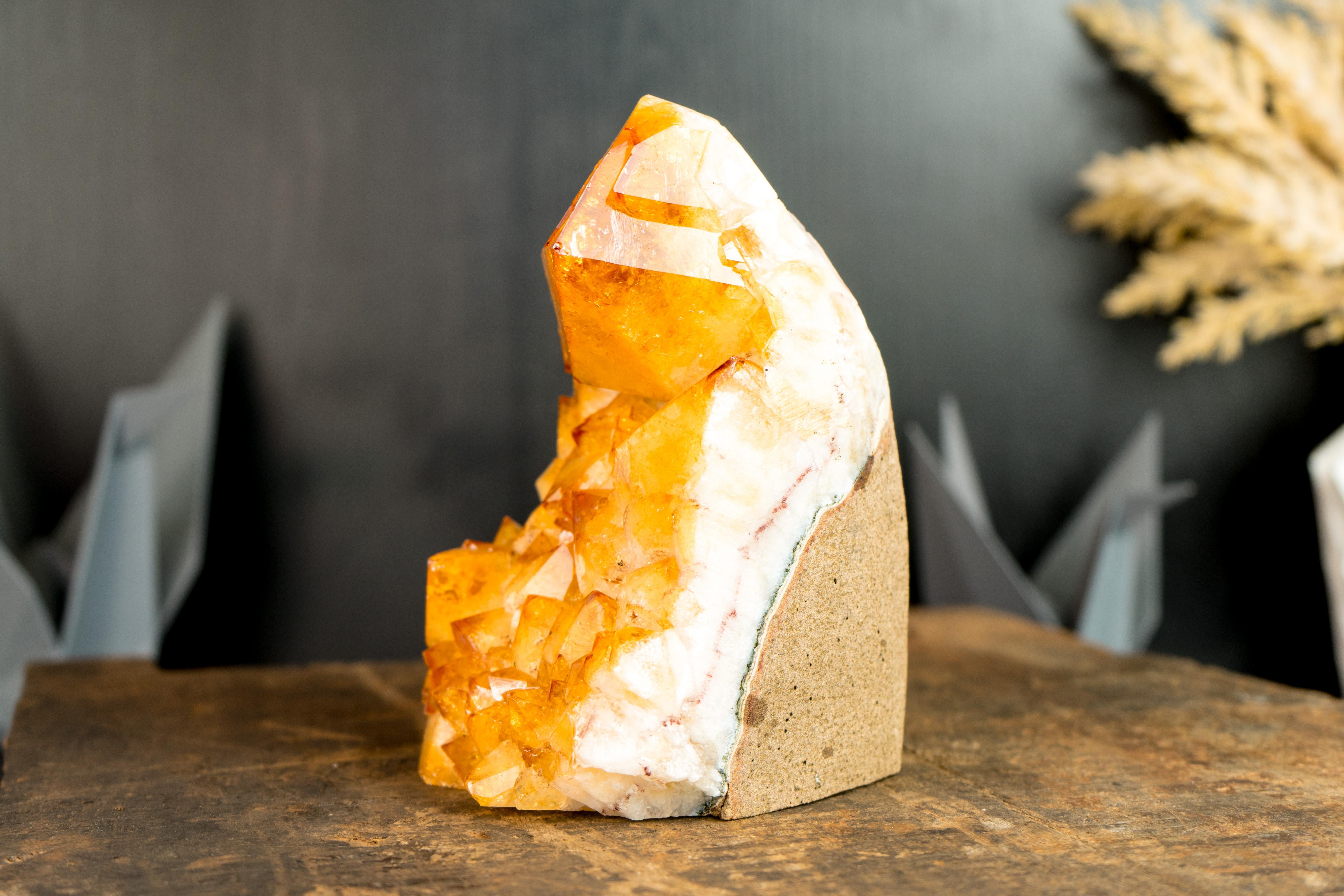 A Citrine Cluster that brings a rarely seen large Point that adds to the gorgeous aesthetics of the specimen, this citrine is ready to be a focal point in your collection as well as an energetic accent in your room.

The citrine druzy is the main