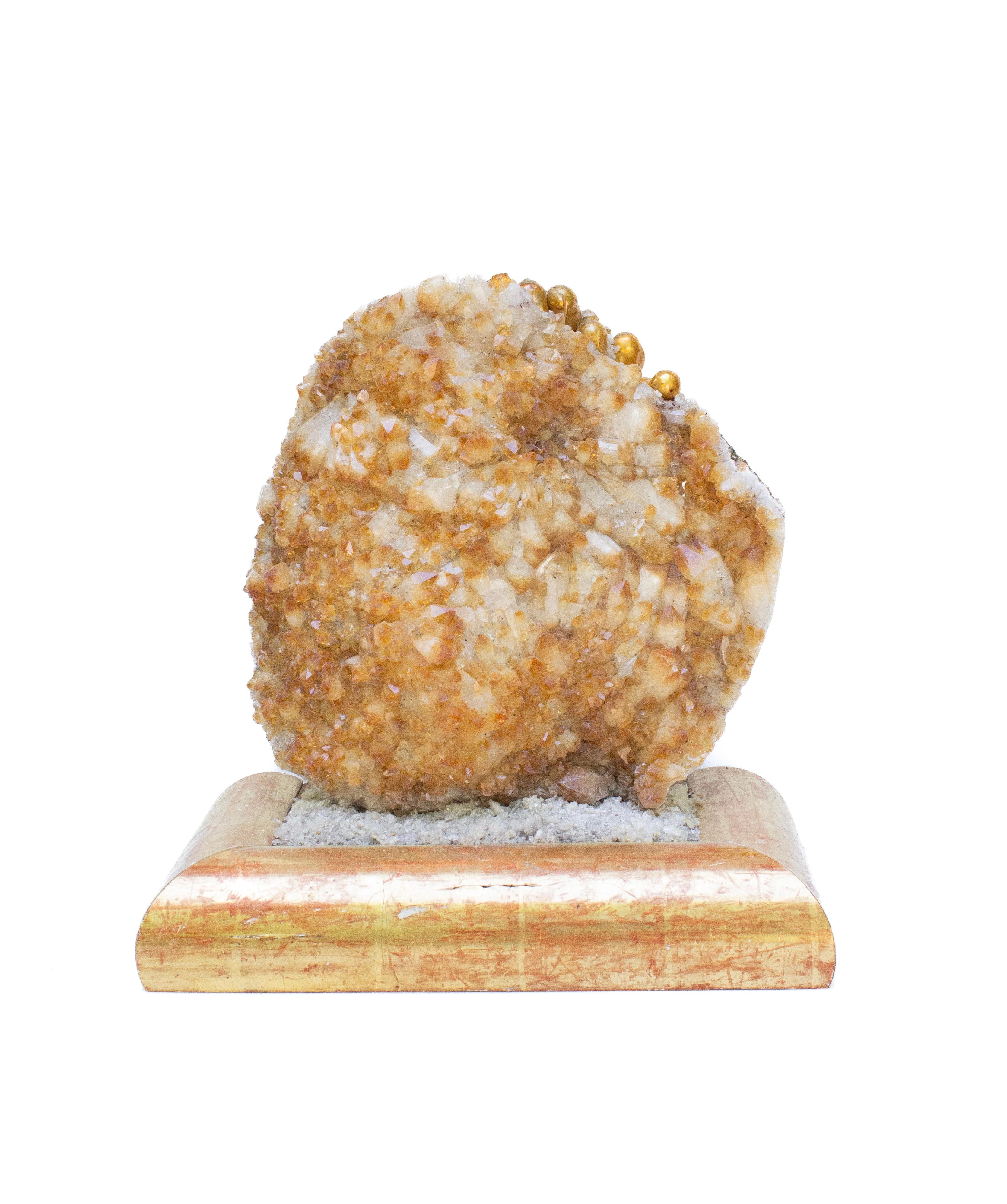 Citrine crystals in matrix mounted on a gilded 18th century Italian base. The citrine crystal specimen is adorned with baroque pearls and it sits in a bed of crushed crystals and coordinates with the original 18th century Italian giltwood base.