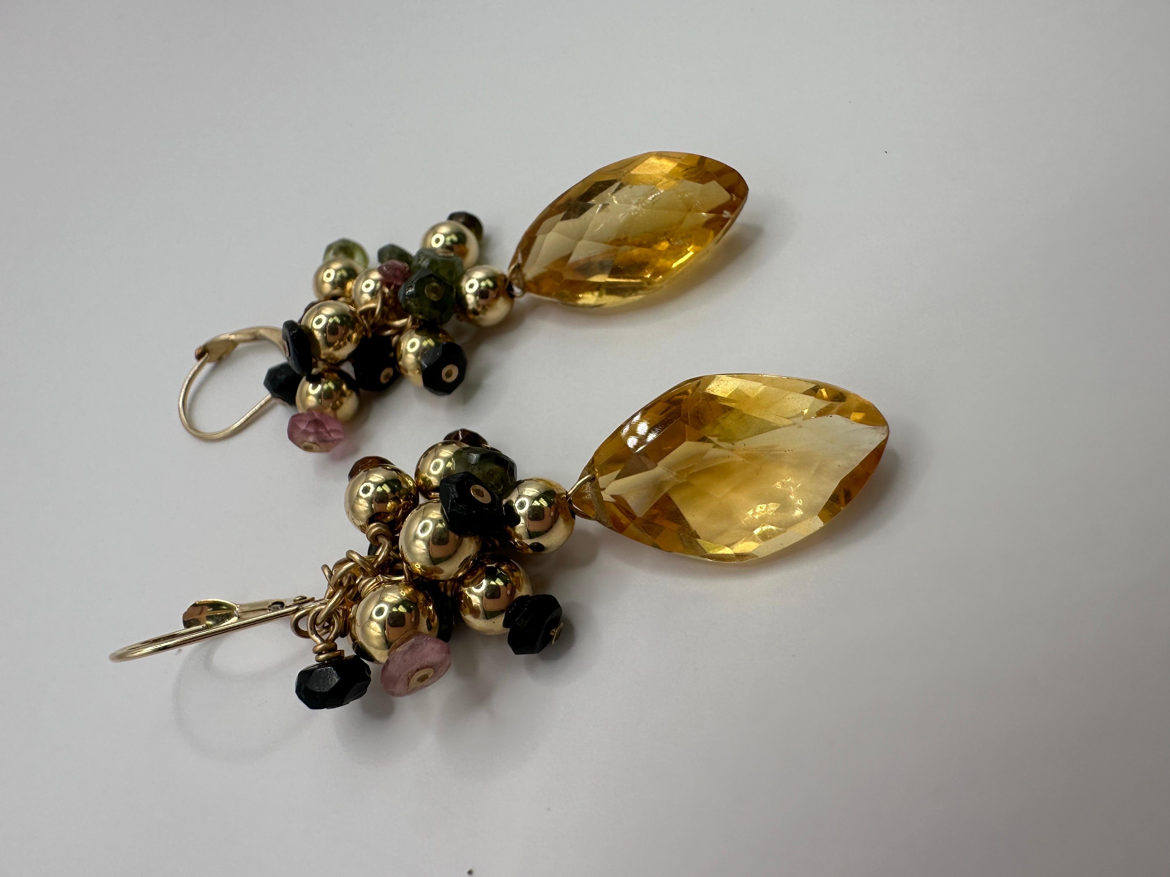 Cute dangling earrings with natural citrines and tourmalines in beautiful summer combo made in 14KT gold!

Metal Type: 14KT

Natural Gemstones(s): 
Color: Yellow,Pink, Green
Cut:Round Briolette, Fancy shape 
Clarity: Slightly Included  

Certificate