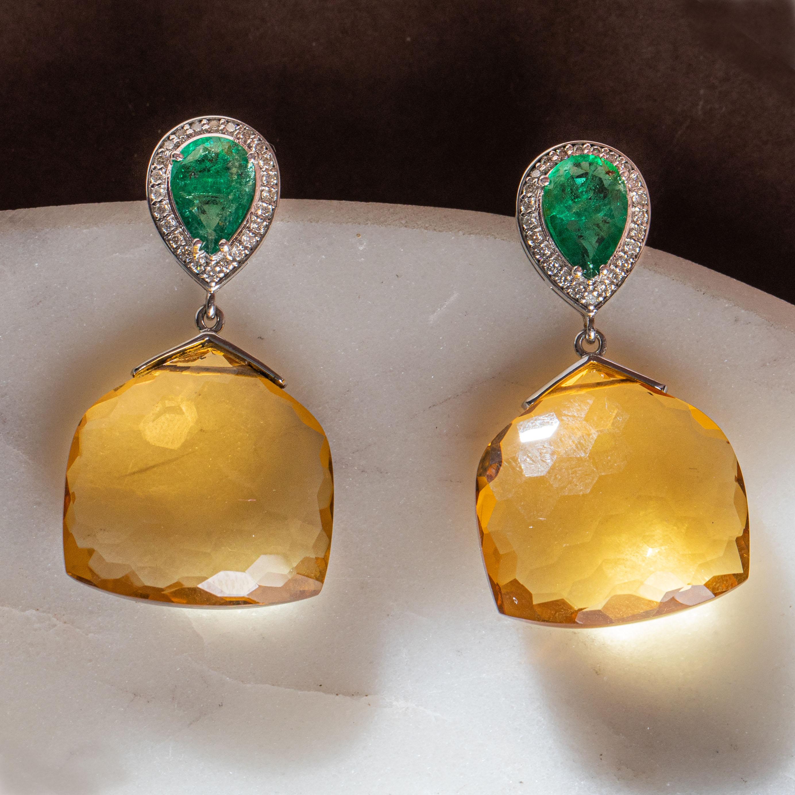 Feast your eyes on these vivid Citrine and Emerald Gemstone Dangle Earrings encircled by Natural Diamonds. The hook and suspension are made with pure 14K Yellow Gold. Pair yours with everything – these wonders can take you through day and night