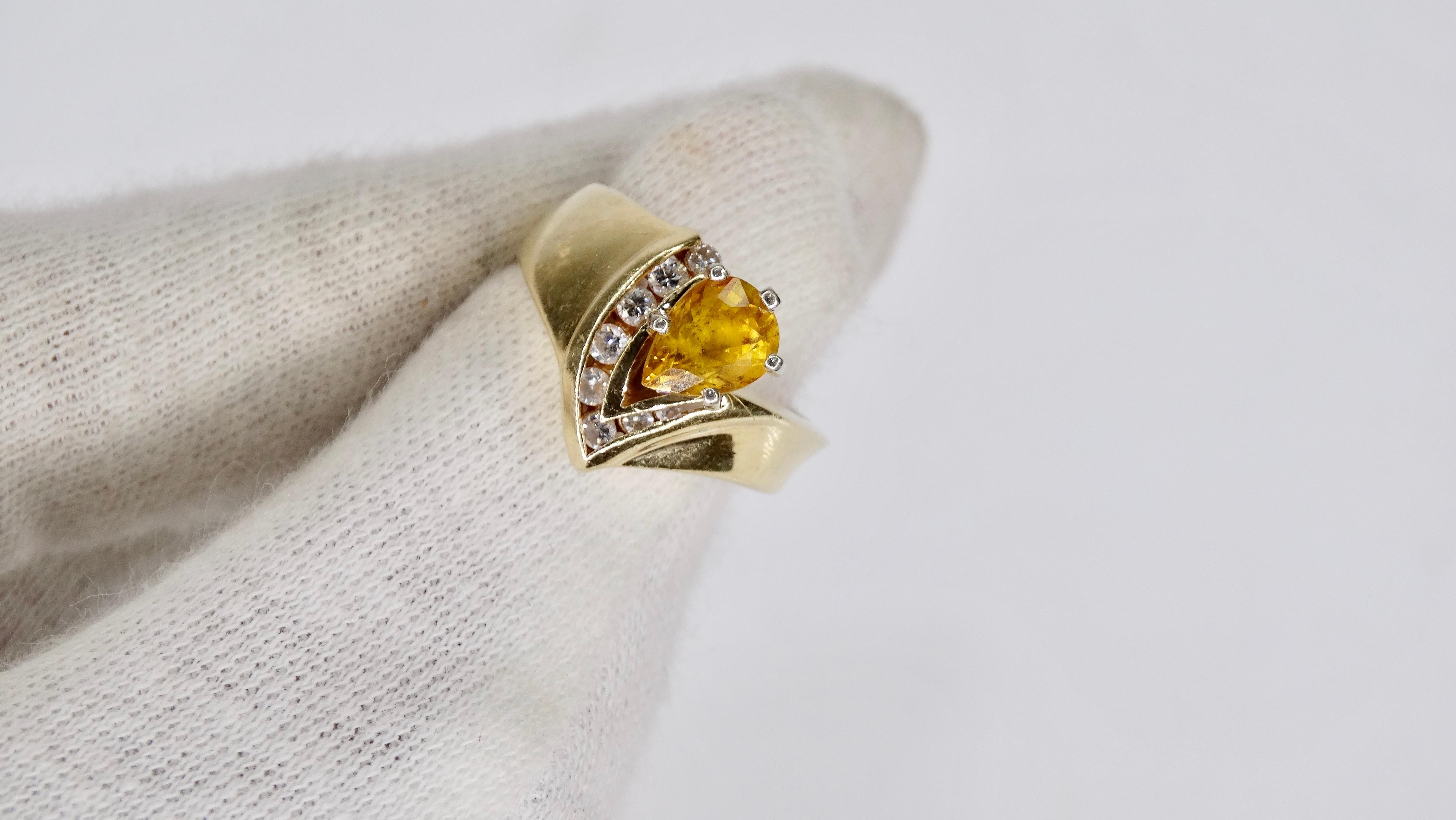 Beautiful mid 20th century 14k Gold ring with a pear cut Citrine stone in a prong setting surrounded by 7 Diamonds in a v-shaped channel setting. Ring is a size 4.5 and weighs 5.6g total. Perfect to wear for a night out with your favorite vintage