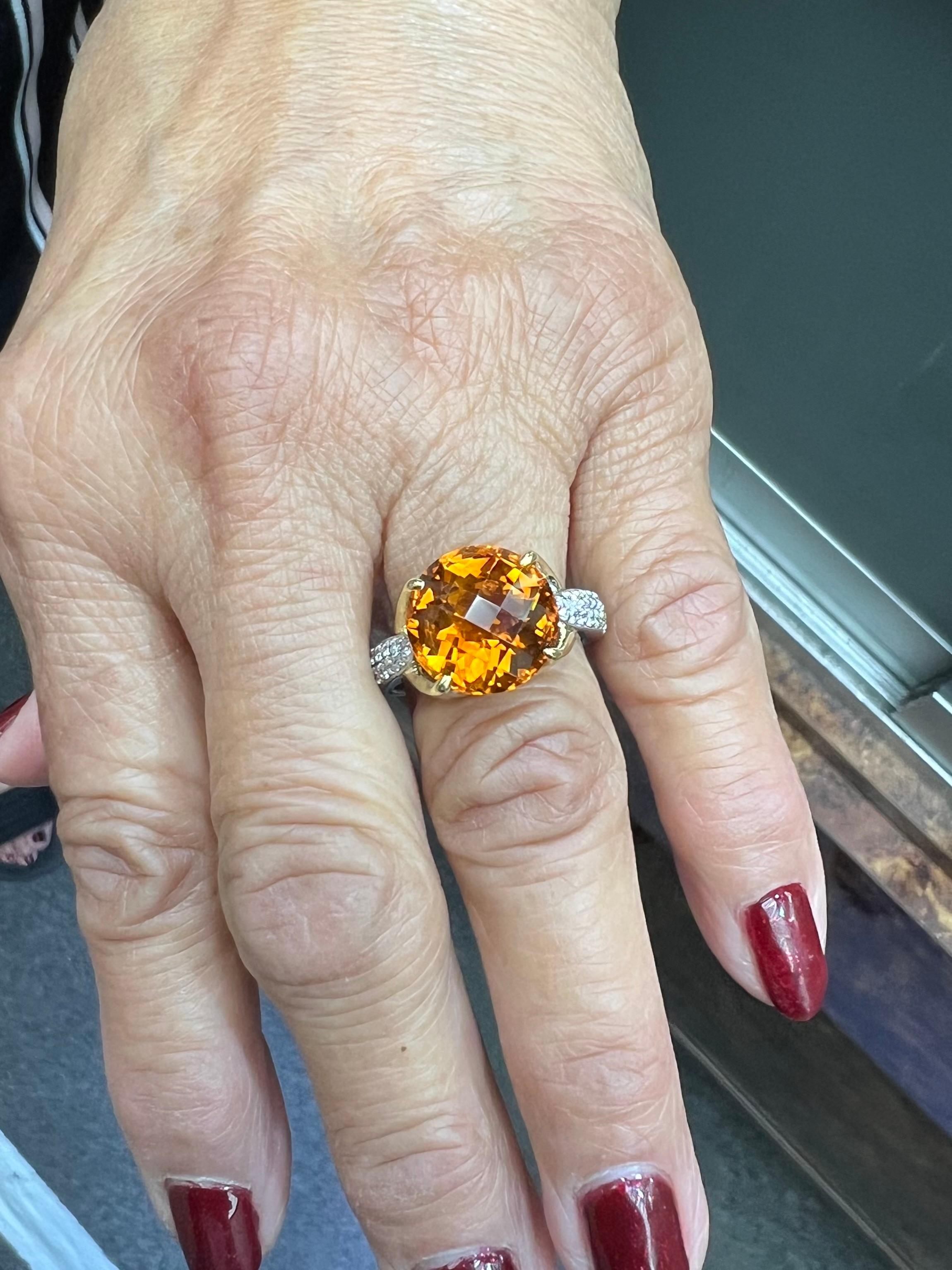 Citrine Diamond 18k White and Yellow Gold Ring by Spark Creations.

This one of a kind ring by Spark Creations features a unique round shaped special cut Citrine held by four prongs and flanked down the sides of the shank with pave diamonds.  A most