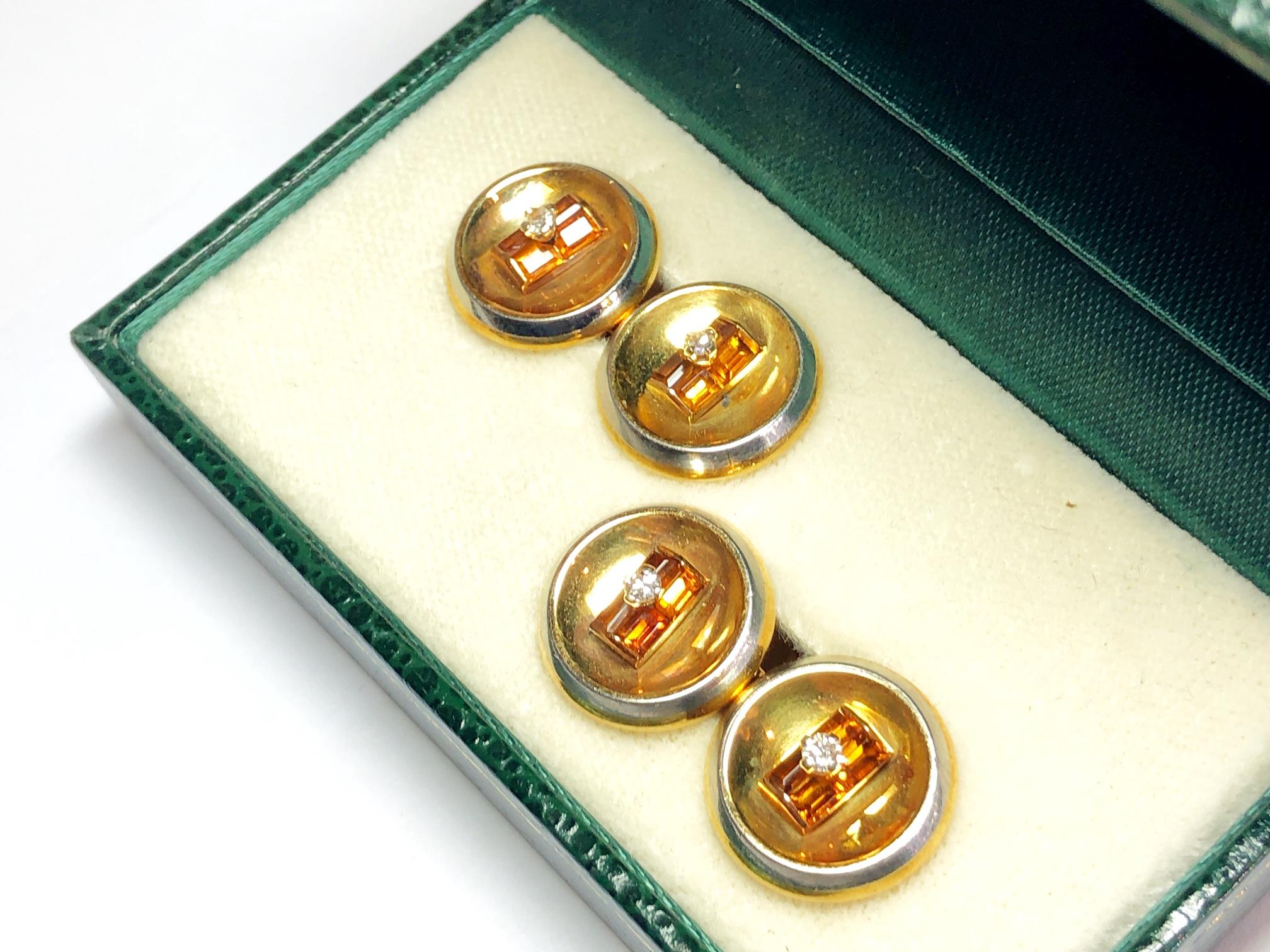 A pair of two colour gold and citrine cufflinks, mounted in 18ct yellow gold, with a white gold edge, set with four baguette-cut citrines, with an eight-cut diamond in the centre, with French eagle mark. Circa 1960.