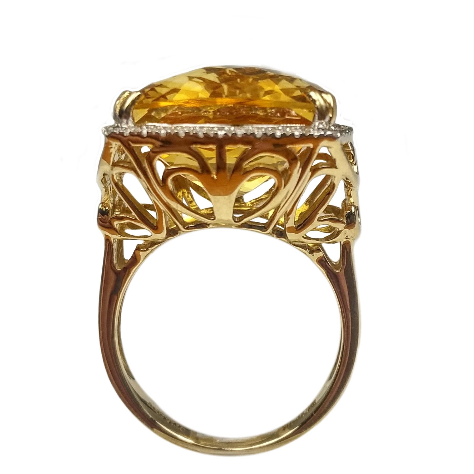 Cocktail citrine and diamond ring. Handcrafted cushion faceted, rich golden honey yellow citrine set in high profile, encased in basket mounting with eight bead prongs,  accented with round brilliant cut diamond frame. Contemporary design set in