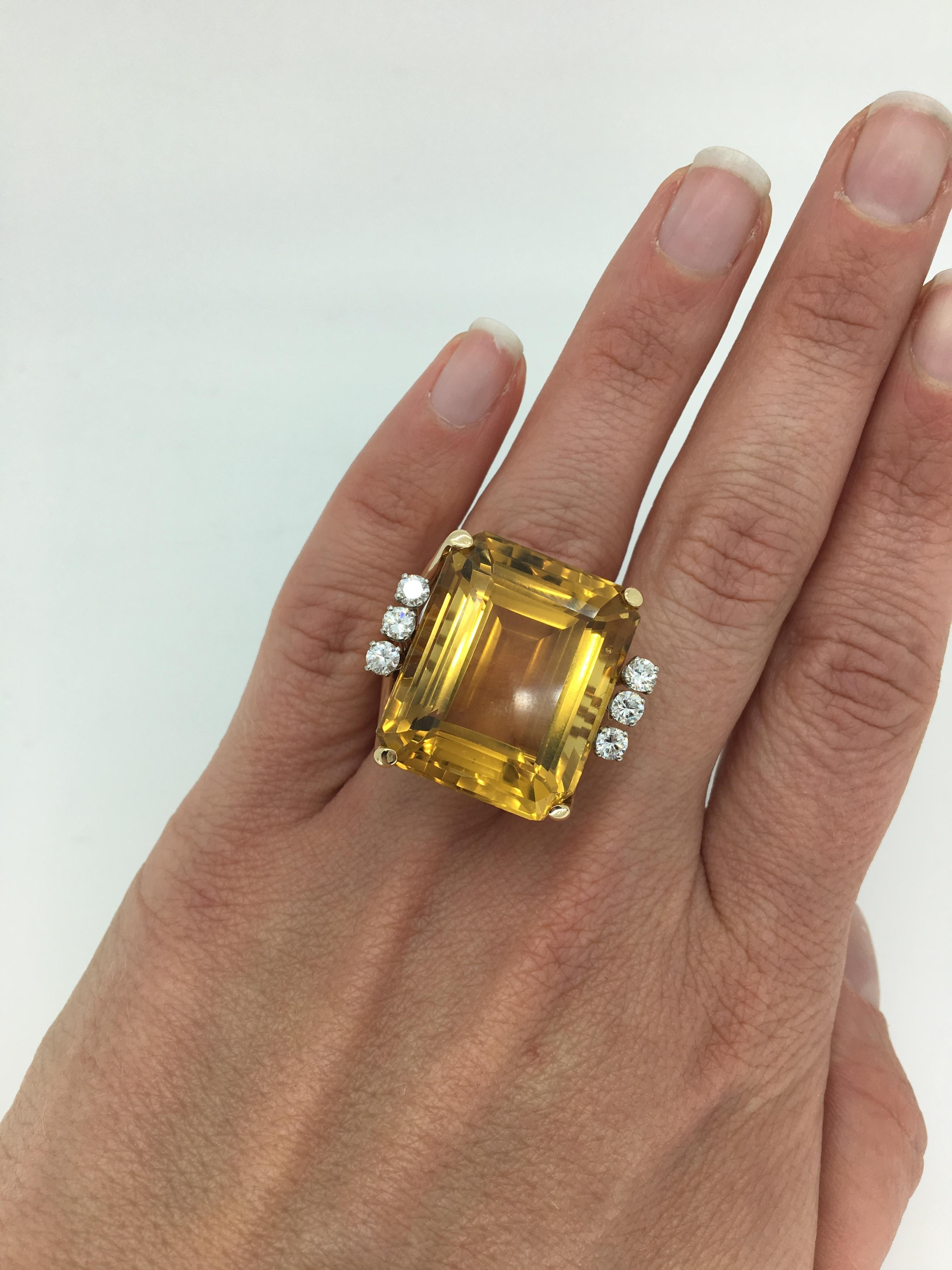 Glamorous emerald cut citrine adorned with 6 stunning Round Brilliant Cut Diamonds. 
 
Gemstone: Citrine Quartz & Diamond
Gemstone Carat Weight: Approximately 42CT Emerald Cut Citrine Quartz
Diamond Carat Weight: Approximately .60CTW
Diamond Cut: