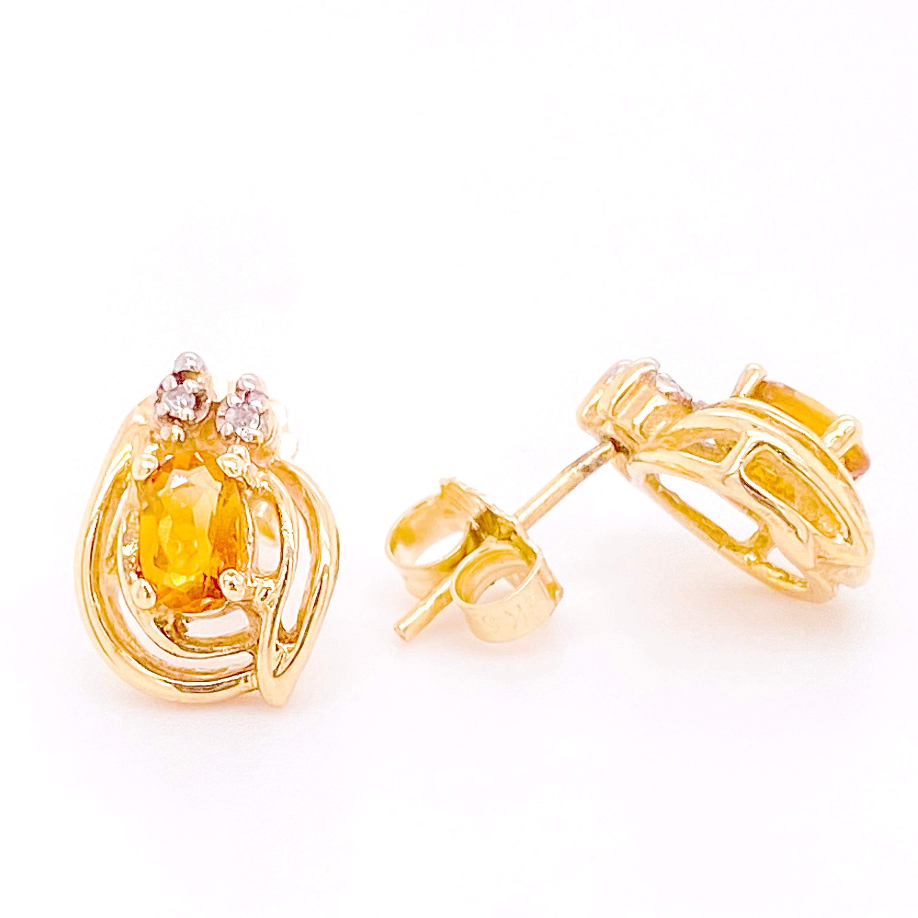 These citrine and diamond earrings are a nice minimalist look. Constructed out of solid 14 karat yellow gold with an oval genuine citrine and an accent diamond in each. There is gold swirl that goes around each gemstone.
The details for these
