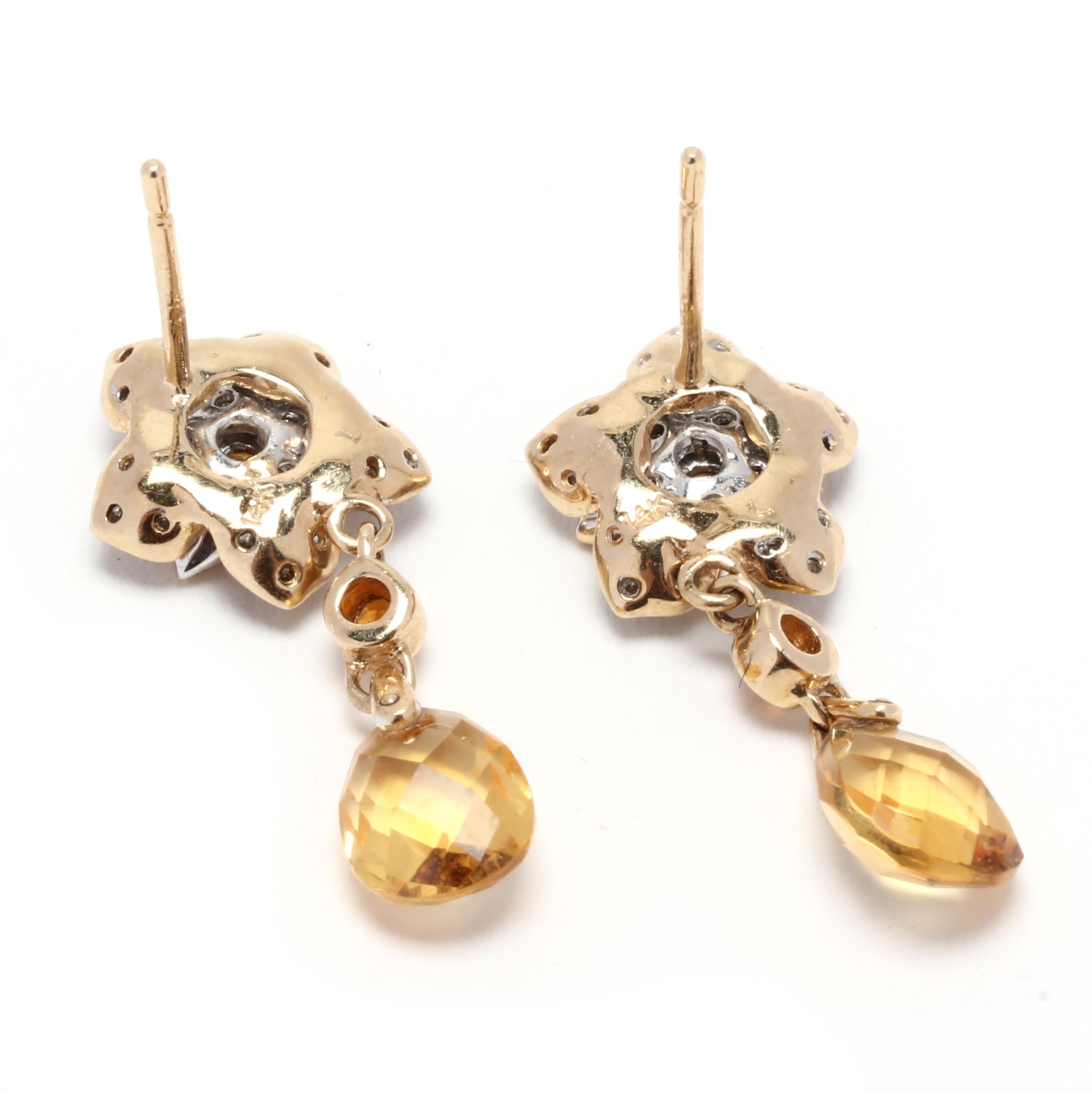 These Citrine Diamond Flower Dangle Earrings are a stunning and unique addition to any jewelry collection. Made with 14K yellow gold, these earrings feature a beautiful flower design with a vibrant citrine gemstone at the center. The citrine