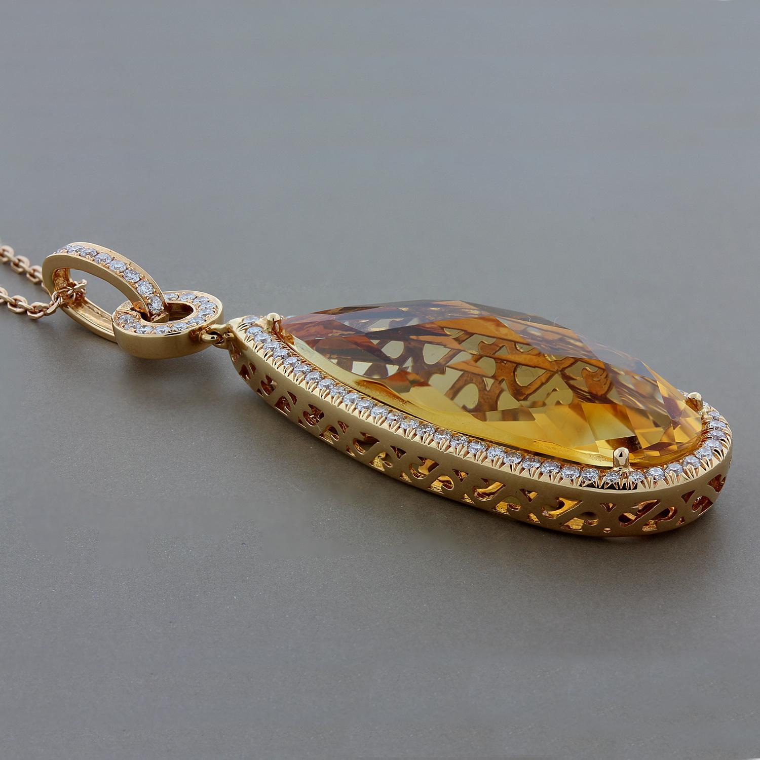 This piece is true show stopper.  The 21.80 carat pear shape citrine is haloed by 0.89 carats of VS quality diamonds.  The back of the pendant is detailed with whimsical heart shapes further accentuating this beautiful pendant.  Set in 18K rose