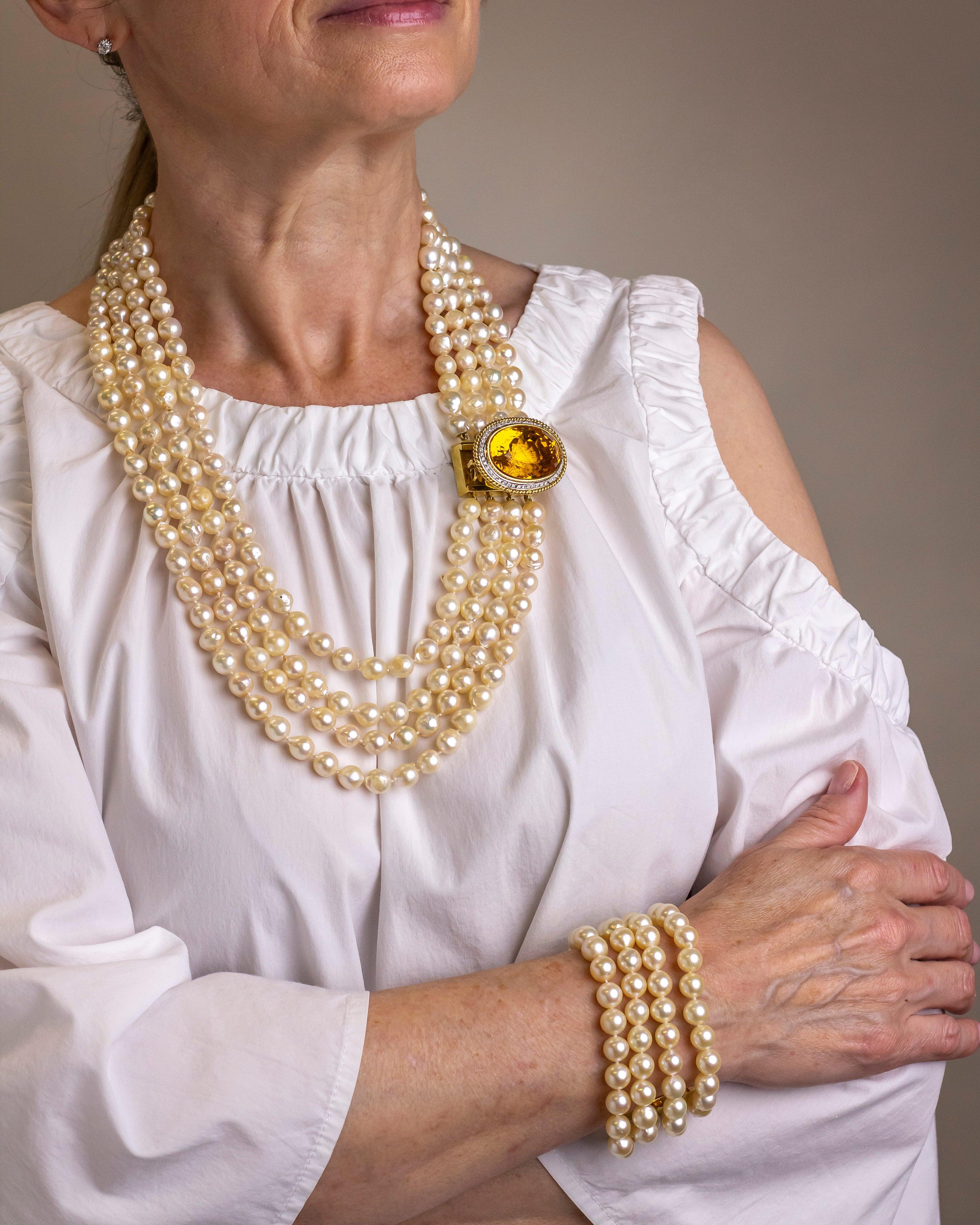 We love versatile jewellery and this suite is extremely wearable in that it can adorn the body in three ways. The suite comprises a four strand necklace of individually knotted akoya pearls with a matched four strand bracelet, and a detachable