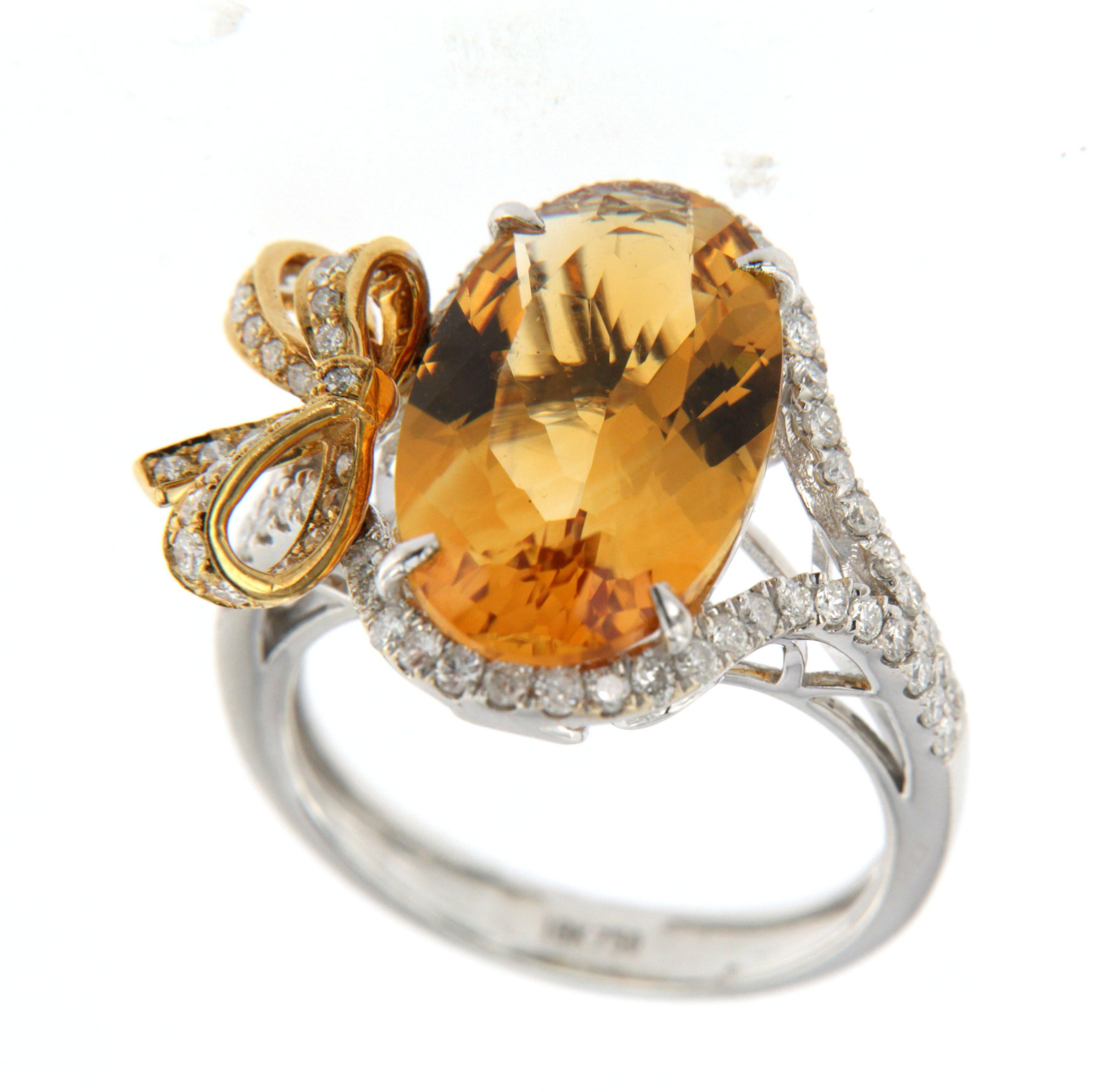 Experience the epitome of luxury with the 5.35Ct Citrine Diamond Ring in 18 Karat White and Yellow Gold, now featuring a stunning white round diamond weighing 0.66 carat. The radiant citrine stone glows with warmth and sophistication, perfectly