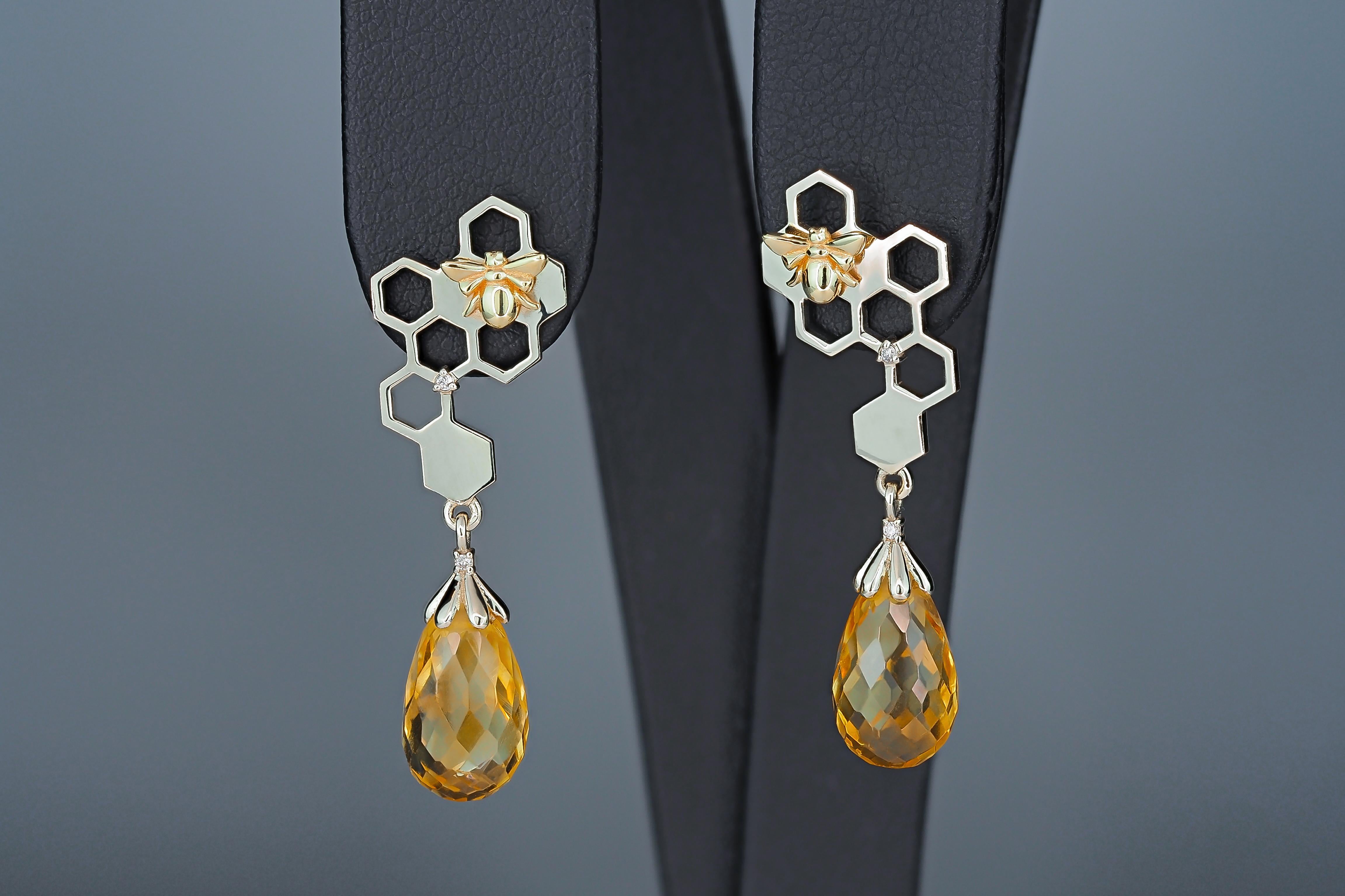 Citrine earrings studs in 14 k gold. 
Citrine dangle earrings. Queen Bee on honeycomb 14k solid gold earrings. GoldBee earrings.

Gold white and yellow (bee) 14k marked.
Weight: 4.21 g.
Earrings size - 33x11.3 mm.

Citrines 2 pieces -yellow color,
