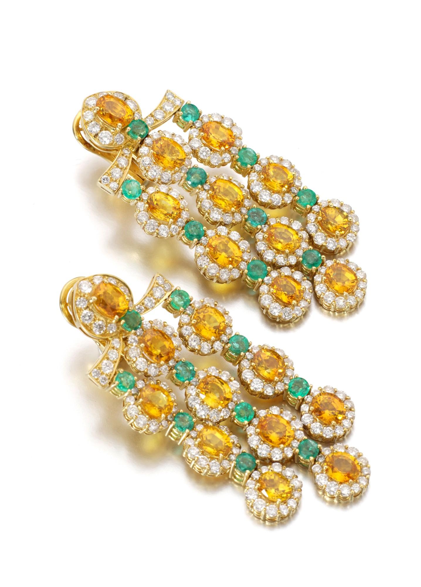 Stunning chandelier earrings set with circular-cut citrine and emeralds, and accented with brilliant-cut diamonds. With collapsible post and clip fittings.