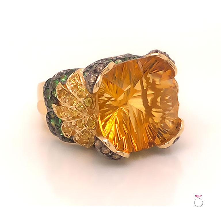 Beautiful designer styled large 14k yellow gold citrine ring. This unique ring features a large yellow citrine stone with sunburst faceting held by 4 heart shaped prongs. The prongs are set with chocolate diamonds, each heart shaped prong has 5