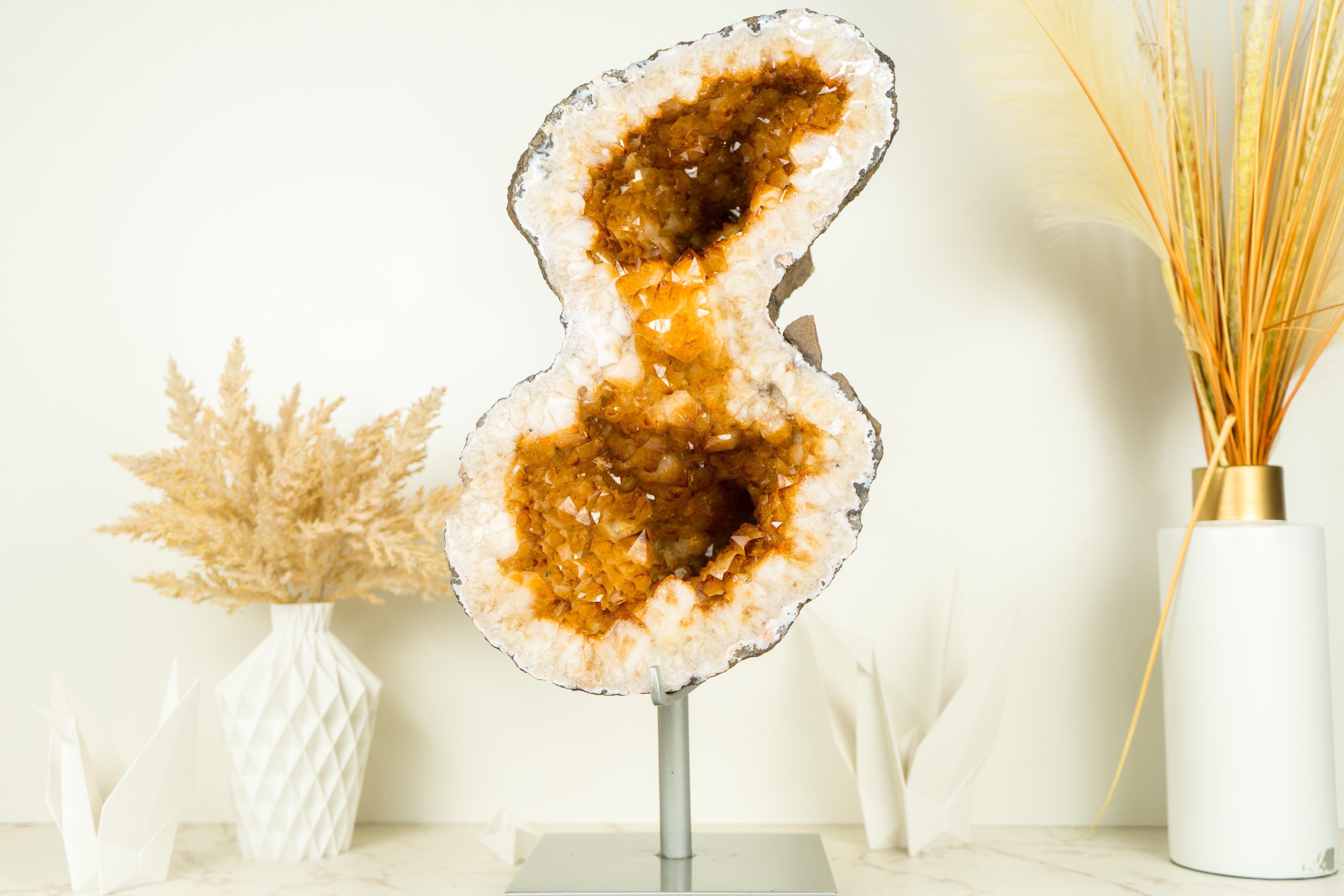 A AAA Citrine Geode that embodies world-class characteristics and a rarely seen Infinite Formation. This geode showcases exceptional druzy quality, sparkling with flawless crystal formations. This Citrine is undeniably a masterpiece, destined to