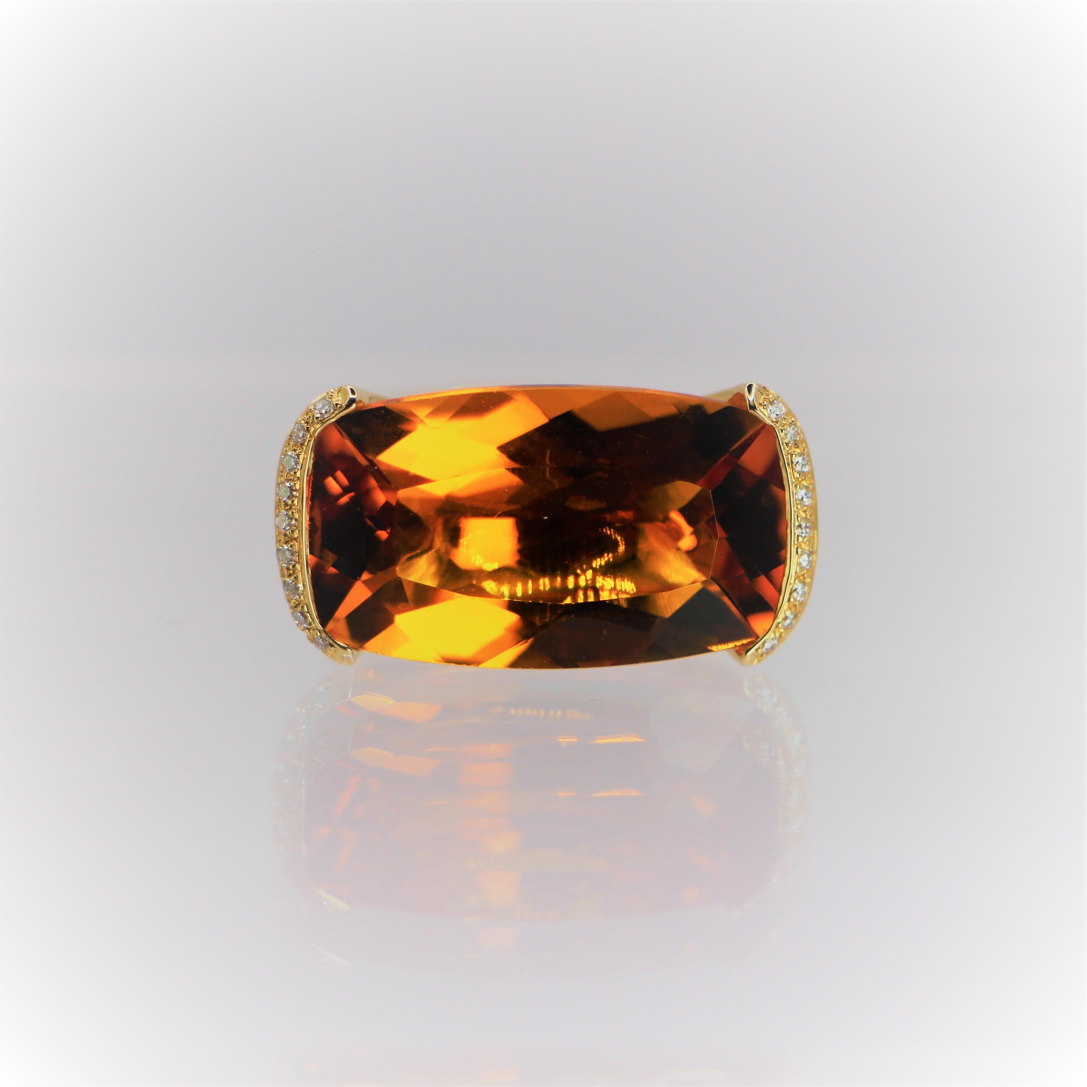 Orange Citrine with Rectangular mix Cut, a Statement Ring in 18Kt  Yellow Gold with Diamonds brilliant cut.
The central stone is a rare orange Citrine 22.6 ct rectangular cut, In the two edges of the stone, two bars with diamonds brilliant cut in