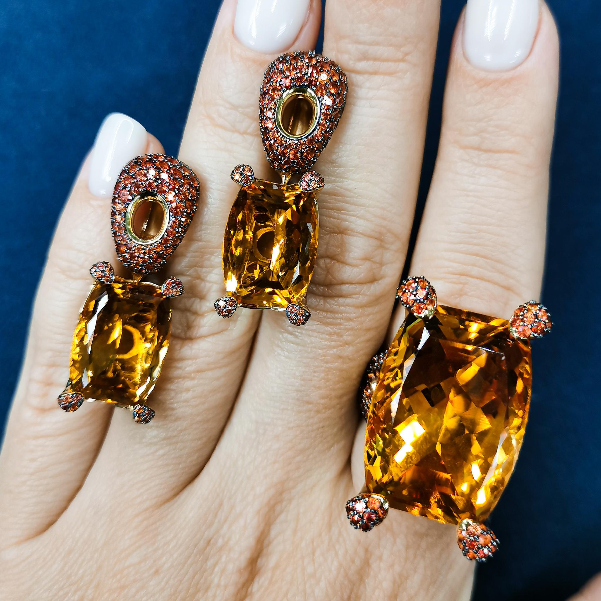Citrine Orange Sapphires 18 Karat Yellow Gold Suite
Highlighting a Citrine and Orange Sapphires are mounted on an 18 Karat Gold lined with black rhodium. It displays a riveting interplay of contrast surfaces with the finest gemstones. Delicate color