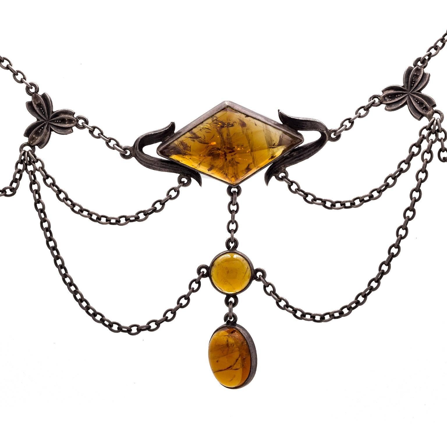 This citrine and oxidized sterling silver draped necklace is a study in amazing design. The citrine is beautifully cut to reflect the yummy rich color of these beautifully matched stones. The chain is handmade and very sturdy as well as light and