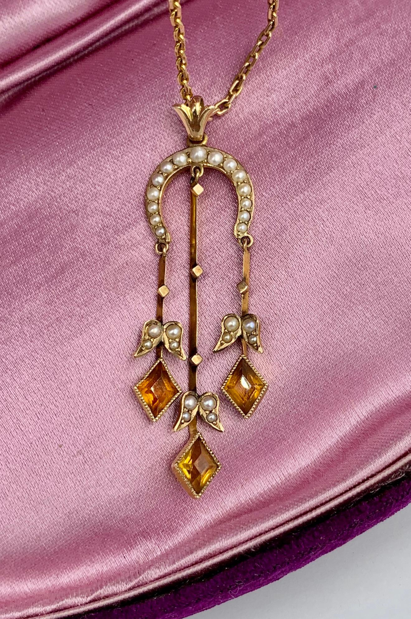 A beautiful early 20th Century Citrine Pearl Pendant Necklace in 10 Karat Yellow Gold with a beautiful 10 Karat Gold Chain.  The jewel is just stunning and bears the maker's mark for the esteemed Fisher Co, Garland, of Newark, New Jersey.  The rare
