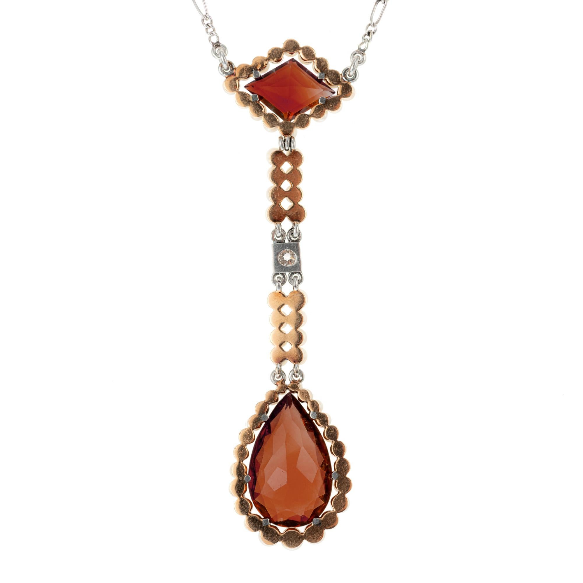 Art Deco 1920's Art Deco Lavaliere style Platinum and pink gold handmade pendant.  A diamond shaped citrine, set sideways with a halo of seed pearls connects to a pear shaped citrine, also with a halo of seed pearls. A two row seed pearl strand with