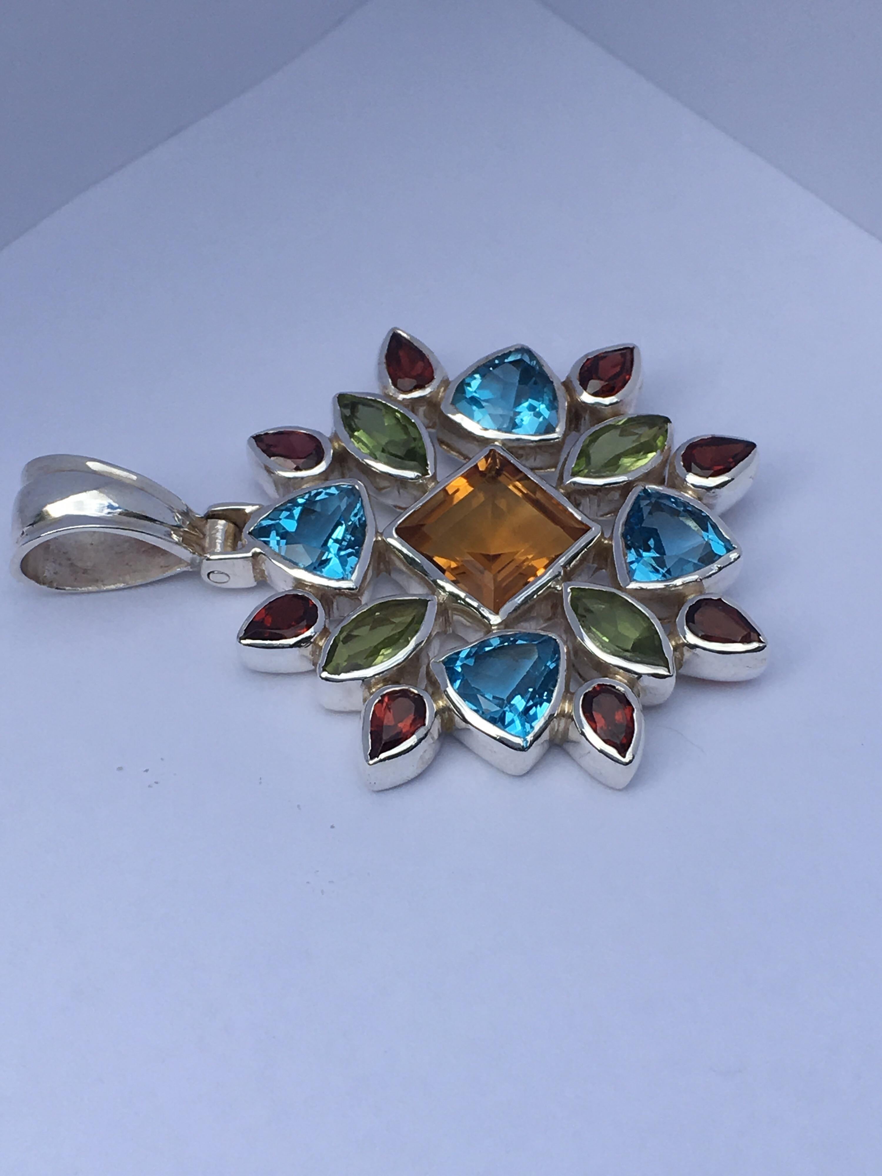 Square Citrine 9 MM, Trillion Blue Topaz 7 MM, Marquise Garnet 4 MM X 8 MM Pendant is 35 MM .
All the stones are natural and hand cut and polished.
Total weight of the Pendant is 12.84 Gram.
You can wear this Pendant with silver chain or leather