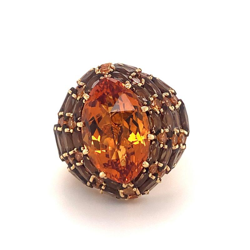 One citrine, smokey quartz and orange sapphire 18K yellow gold “Martini” ring by Rodney Rayner centering one marquise cut citrine weighing approximately 10 ct. Surrounded by marquise cut smokey quartz totaling approximately 6 ct. and round brilliant
