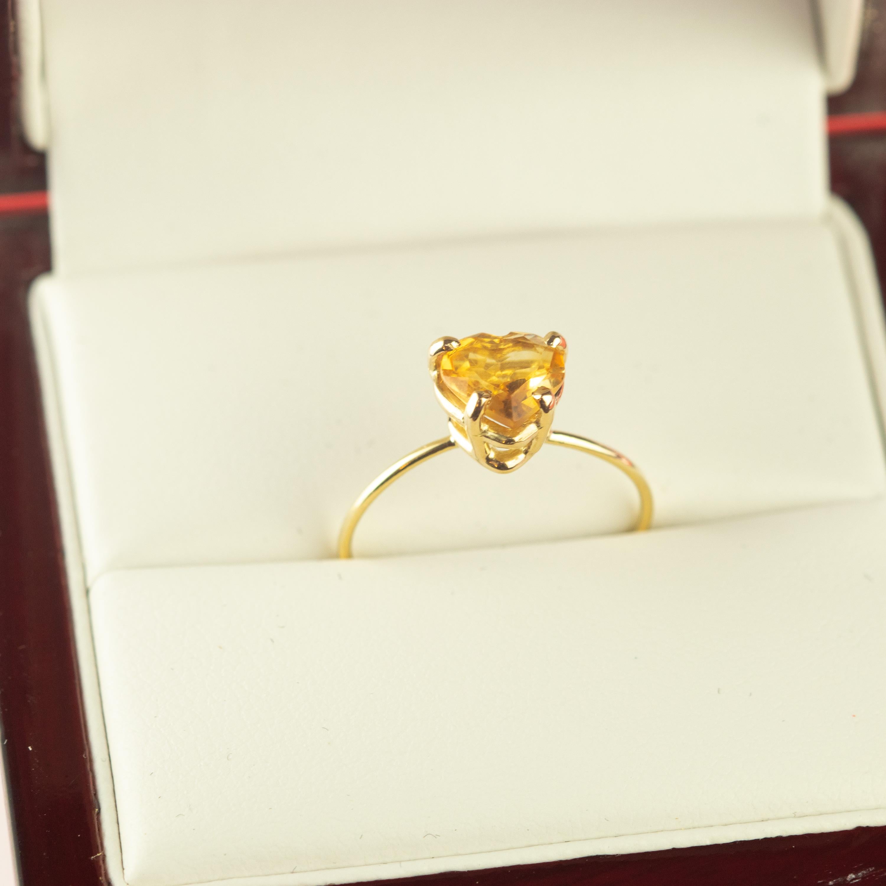 Marvelous handmade 18 karat yellow gold band thin ring embellished with a wonderful heart shaped citrine quartz. Open your intuition and enhance your senses to love. 

Inspired by strong feeling of love. The beating heart is used as an intensive